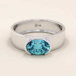 14k solid gold thick band ring with an oval cut topaz in a half bezel setting. Bold yet refined gemstone design. Perfect for stacking or solo wear.