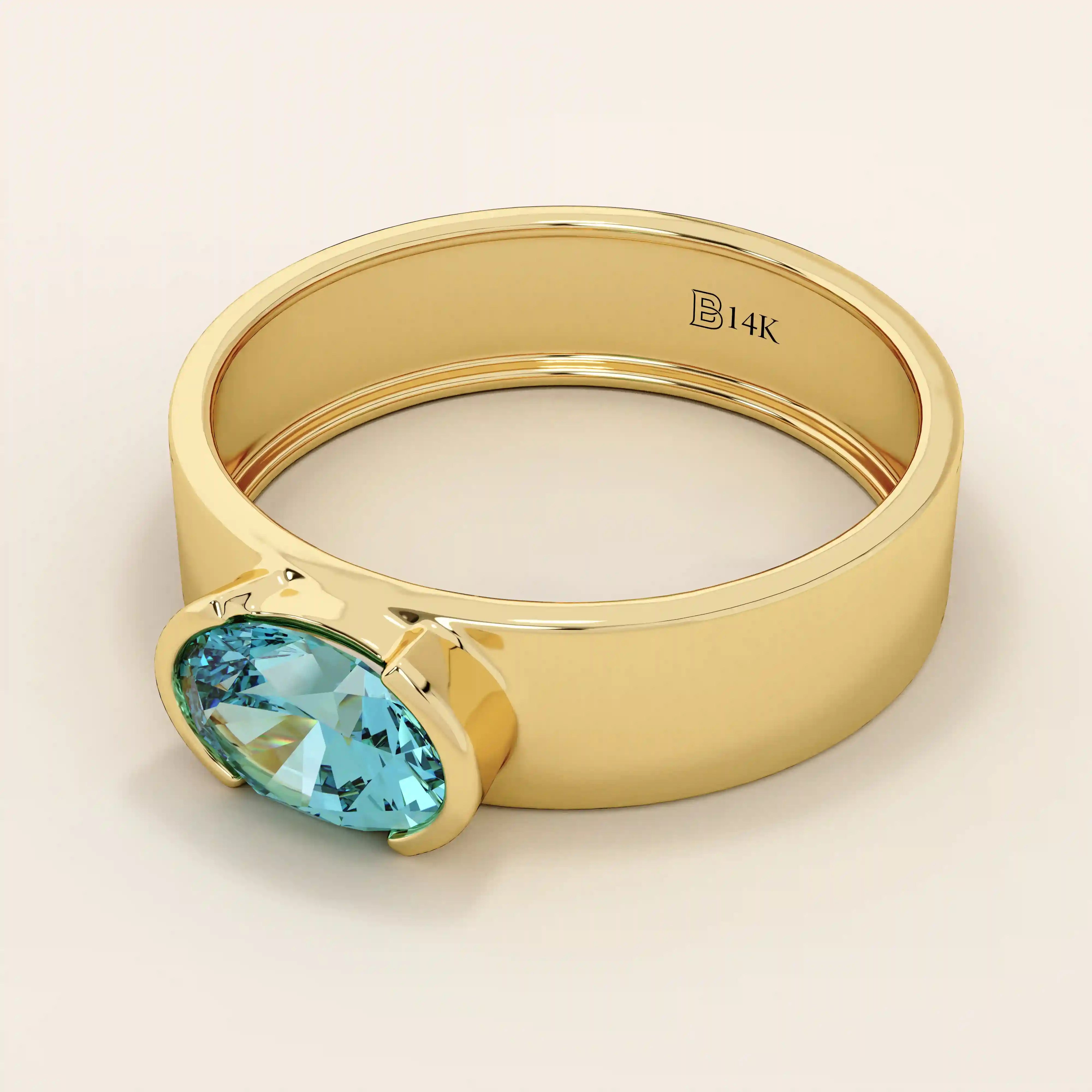 14k solid gold thick band ring with an oval cut topaz in a half bezel setting. Bold yet refined gemstone design. Perfect for stacking or solo wear.