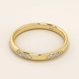 14k solid gold wedding band featuring a repeating trio moissanite pattern. A timeless and refined gold ring with subtle sparkle. Perfect for weddings or everyday wear.