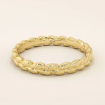 14k solid gold wedding band with a delicate vine pattern wrapping around the band. Nature-inspired and detailed gold ring. Ideal for everyday wear or as a unique wedding band.