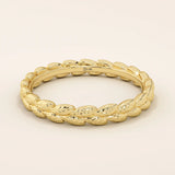 14k solid gold wedding band with a delicate vine pattern wrapping around the band. Nature-inspired and detailed gold ring. Ideal for everyday wear or as a unique wedding band.