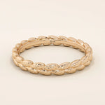 14k solid gold wedding band with a delicate vine pattern wrapping around the band. Nature-inspired and detailed gold ring. Ideal for everyday wear or as a unique wedding band.