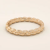 14k solid gold wedding band with a delicate vine pattern wrapping around the band. Nature-inspired and detailed gold ring. Ideal for everyday wear or as a unique wedding band.