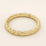 14k solid gold wedding band with a delicate vine pattern wrapping around the band. Nature-inspired and detailed gold ring. Ideal for everyday wear or as a unique wedding band.