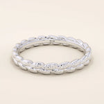 14k solid gold wedding band with a delicate vine pattern wrapping around the band. Nature-inspired and detailed gold ring. Ideal for everyday wear or as a unique wedding band.