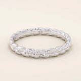 14k solid gold wedding band with a delicate vine pattern wrapping around the band. Nature-inspired and detailed gold ring. Ideal for everyday wear or as a unique wedding band.