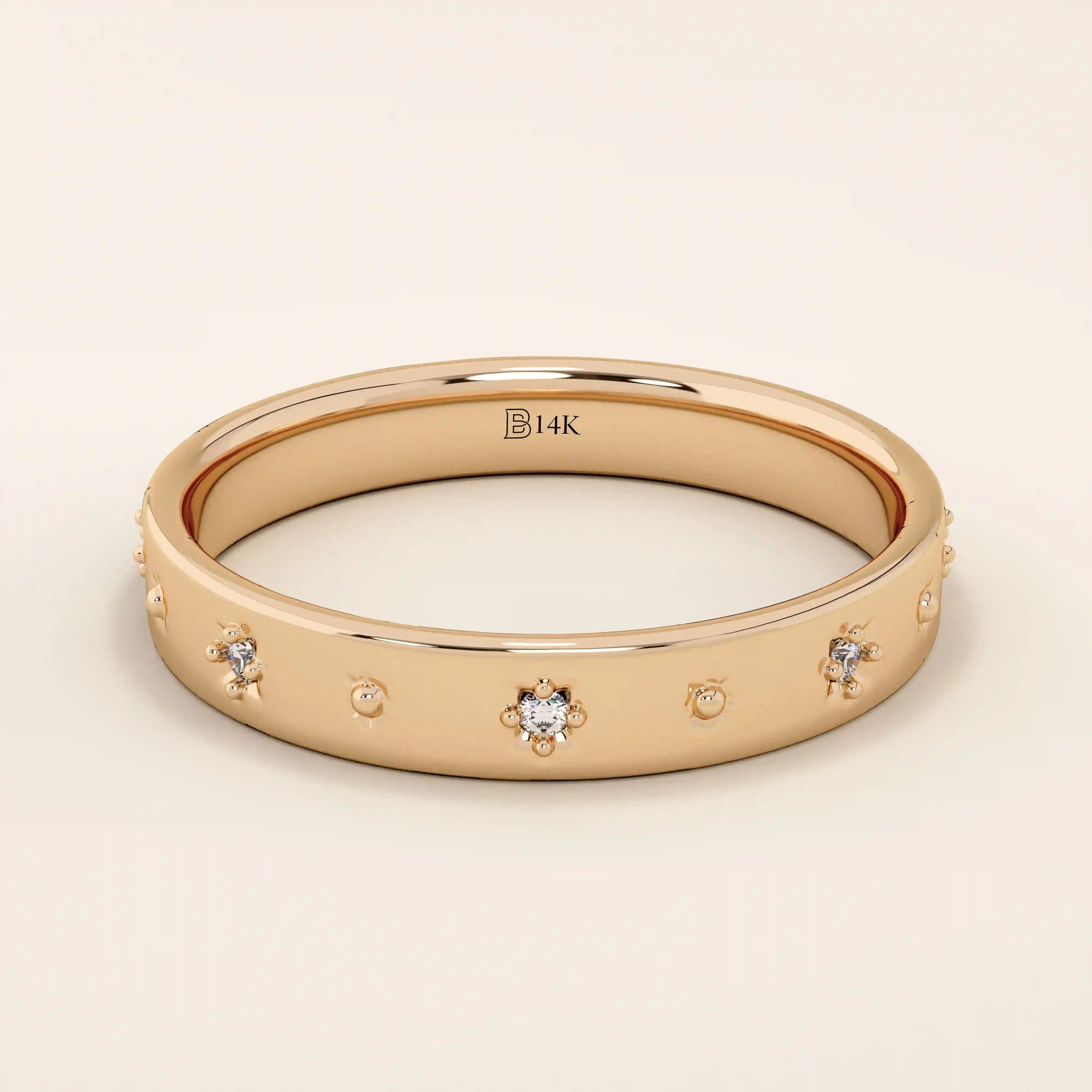 14k solid rose gold wedding band with petite starburst moissanite accents, evenly arranged across the smooth band to create a subtle celestial-inspired sparkle.
