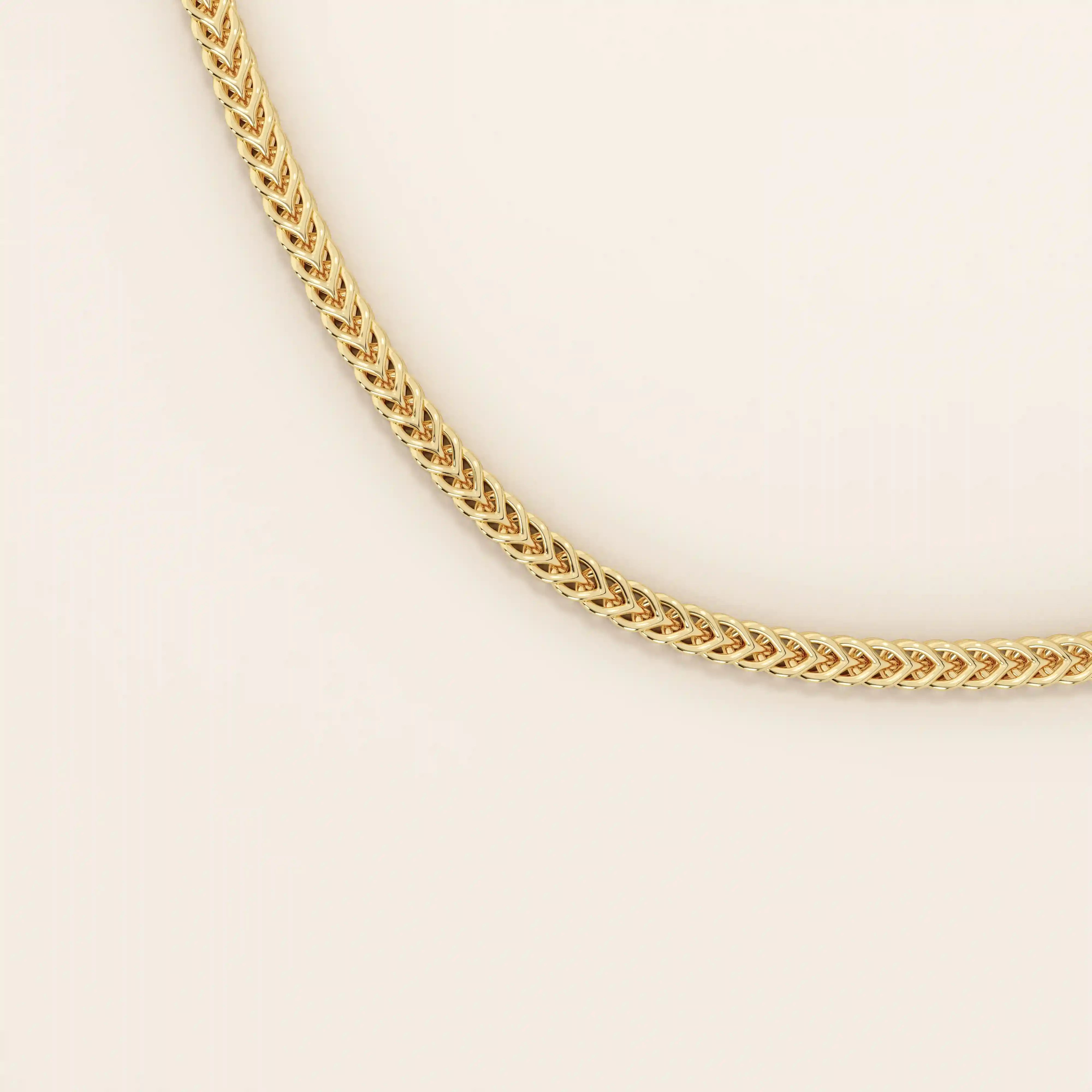 14k solid gold wheat chain necklace with a smooth, tightly woven texture. A classic gold chain with timeless appeal. Ideal for daily wear or layering.