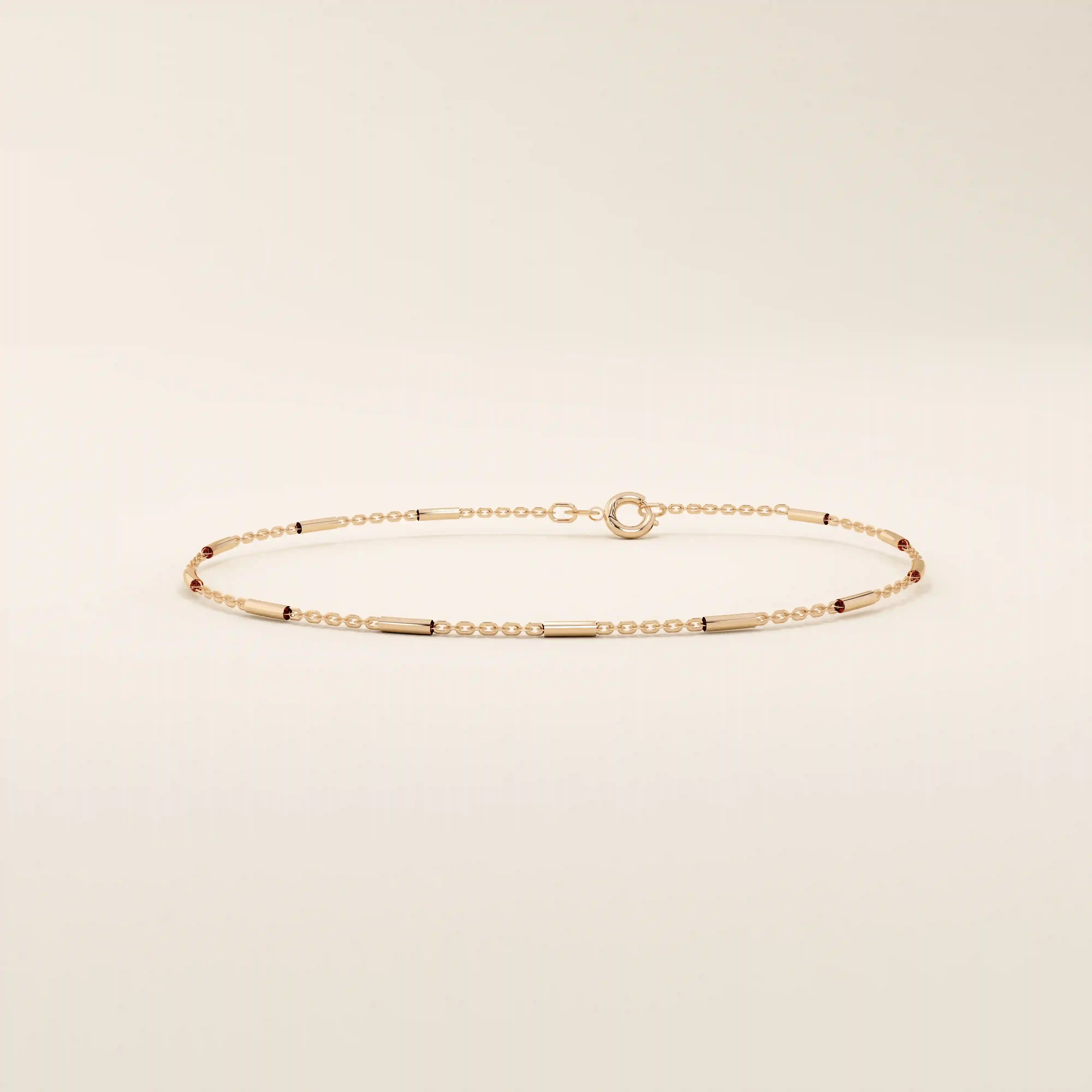 14k solid rose gold bar chain bracelet with smooth rectangular accents, blending warm rosy tones with an understated, minimalist design.
