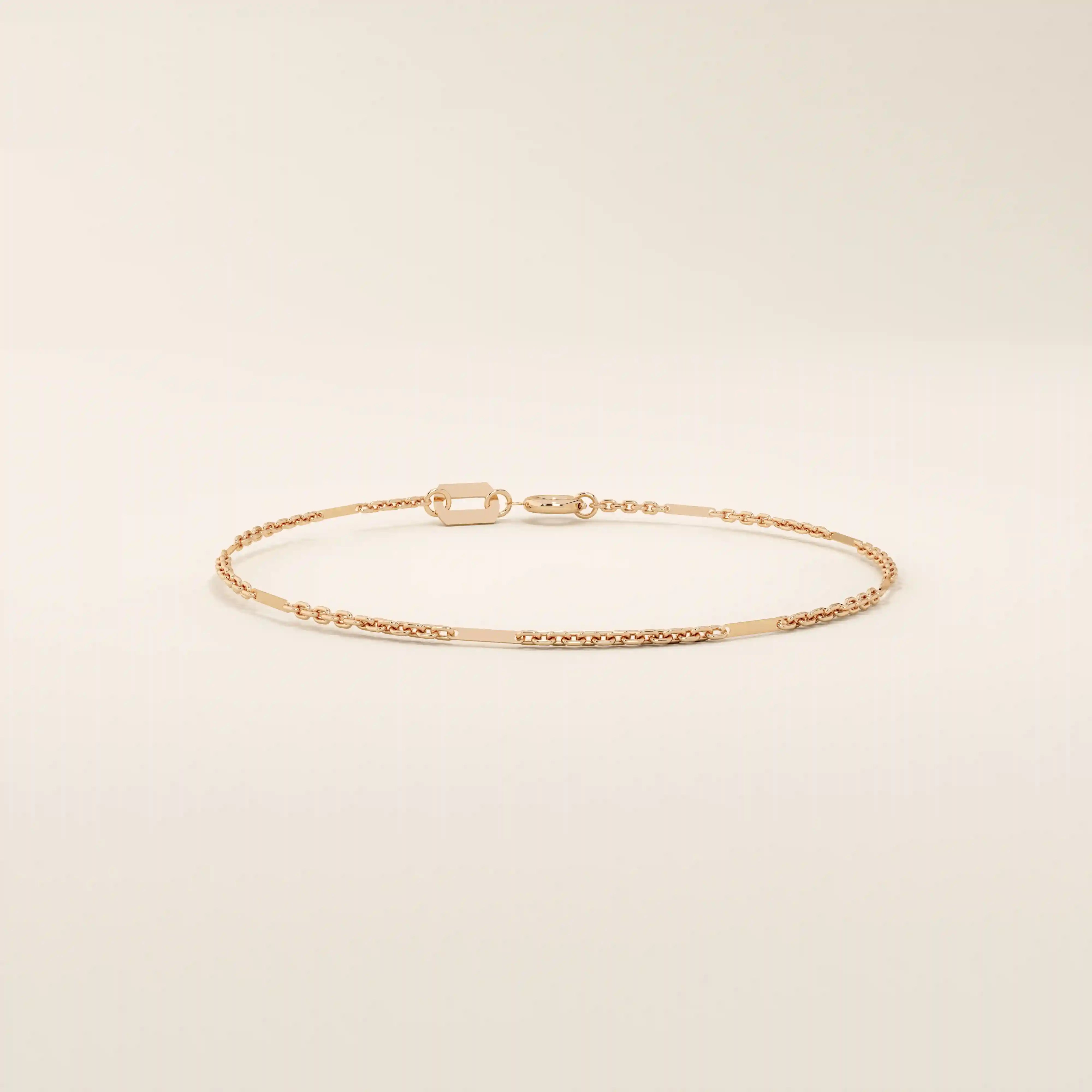 14k solid rose gold flat bar chain bracelet with polished rectangular accents, blending warm blush tones with a refined, minimal design.