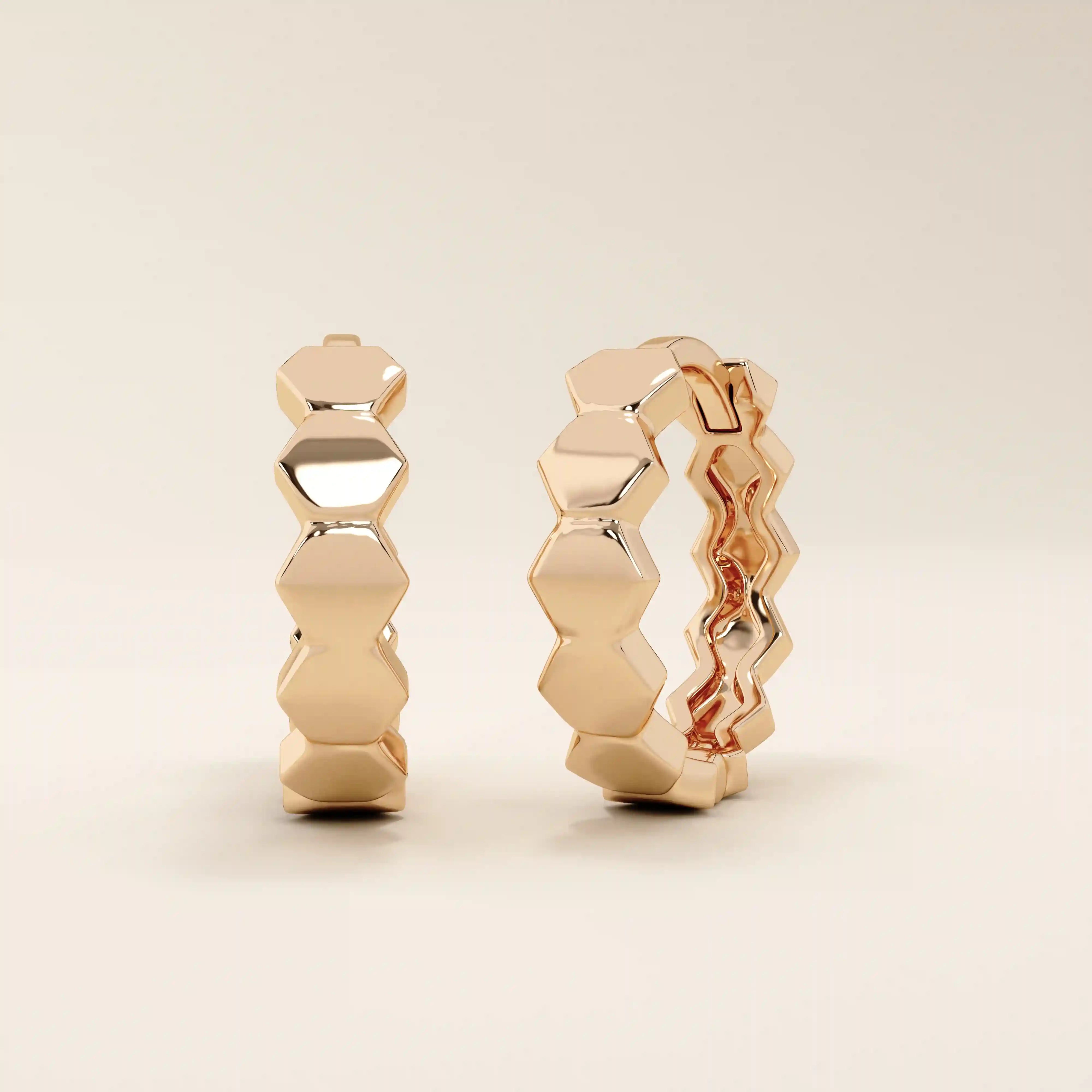 14k solid rose gold hexagon hoop earrings, featuring a linked honeycomb-inspired design with a high-polish finish for a warm, contemporary style.