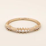 14k solid rose gold ring showcasing round brilliant cut moissanite stones in alternating prong and bead settings, romantic fine jewelry gift