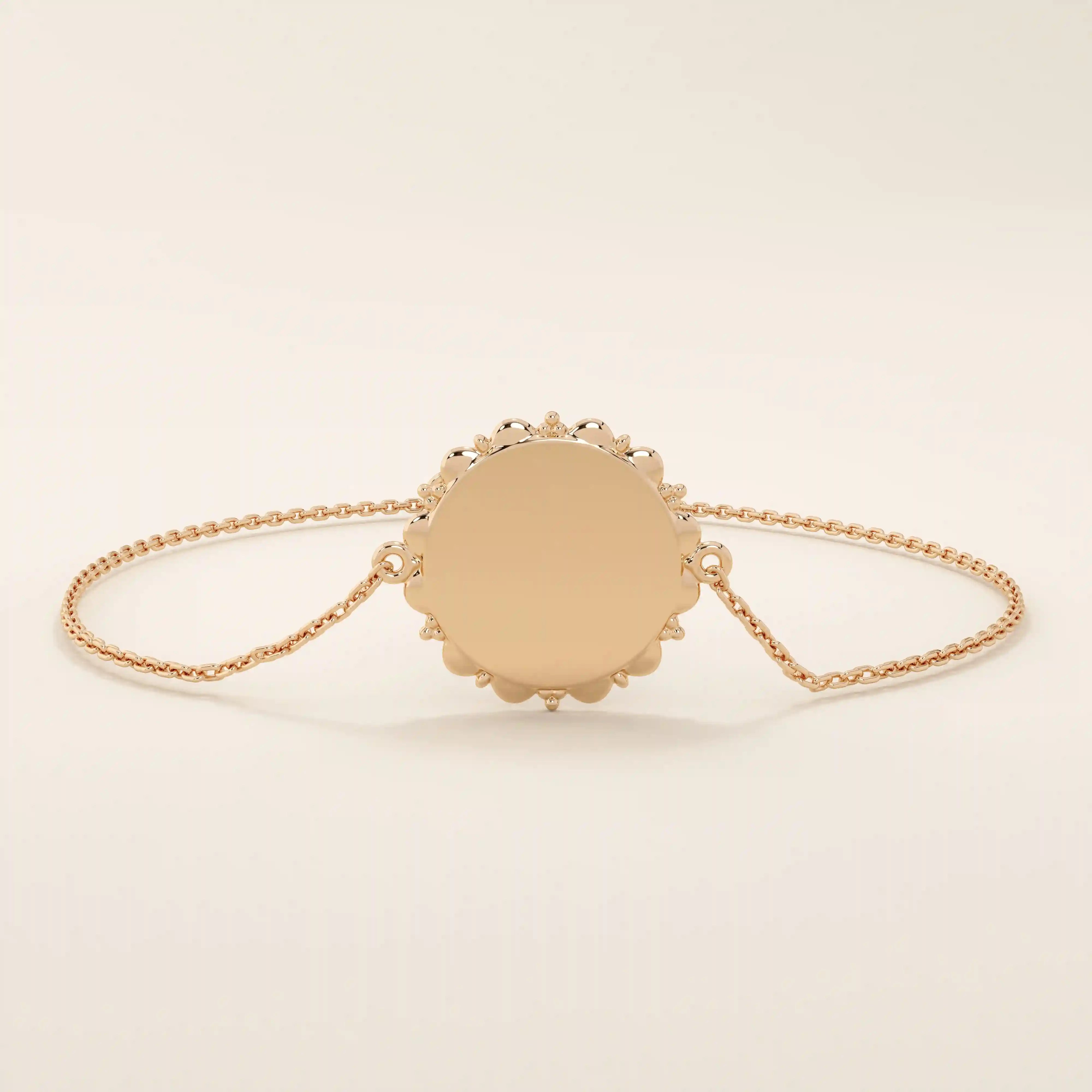 14k solid rose gold sun bracelet showcasing a round medallion with a glowing sun motif and slim chain.