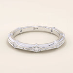 14k solid white gold bamboo-style wedding band, adorned with evenly spaced round brilliant-cut moissanites