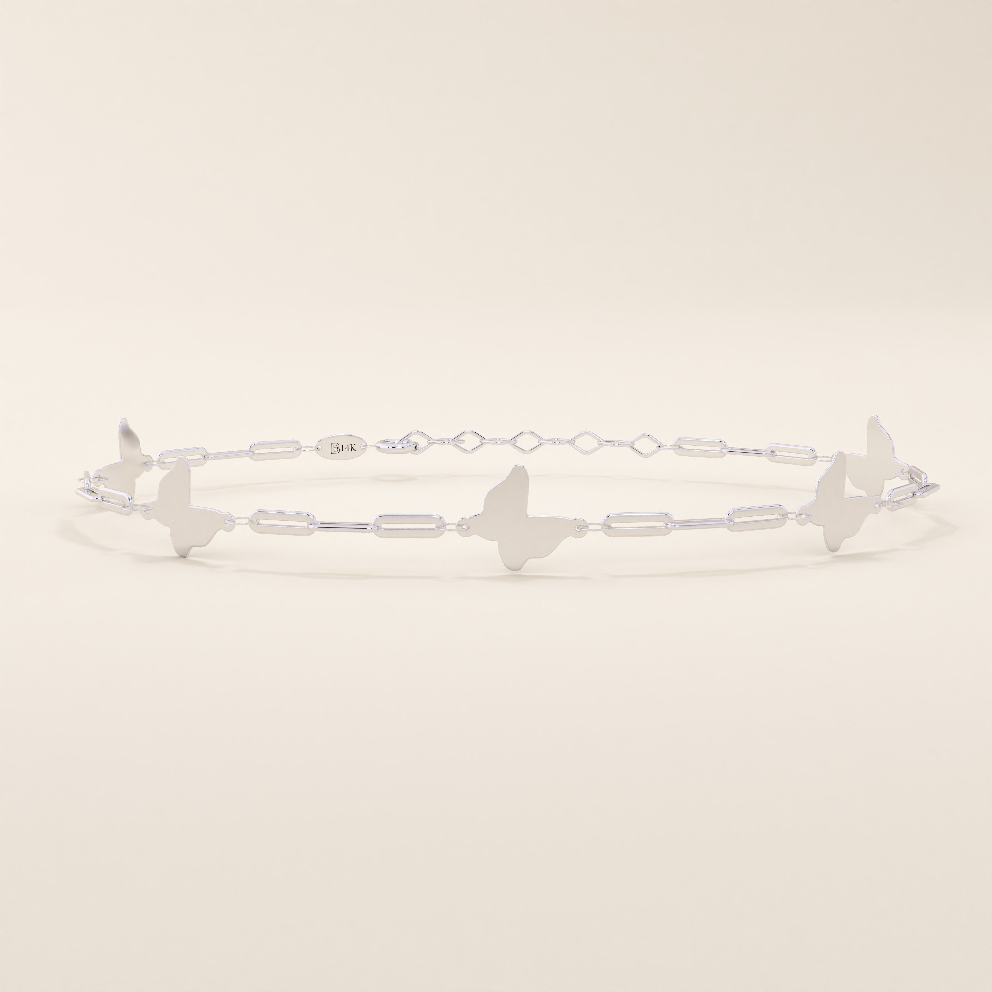 14k solid white gold butterfly chain bracelet with smooth butterfly motifs connected by fine elongated links.