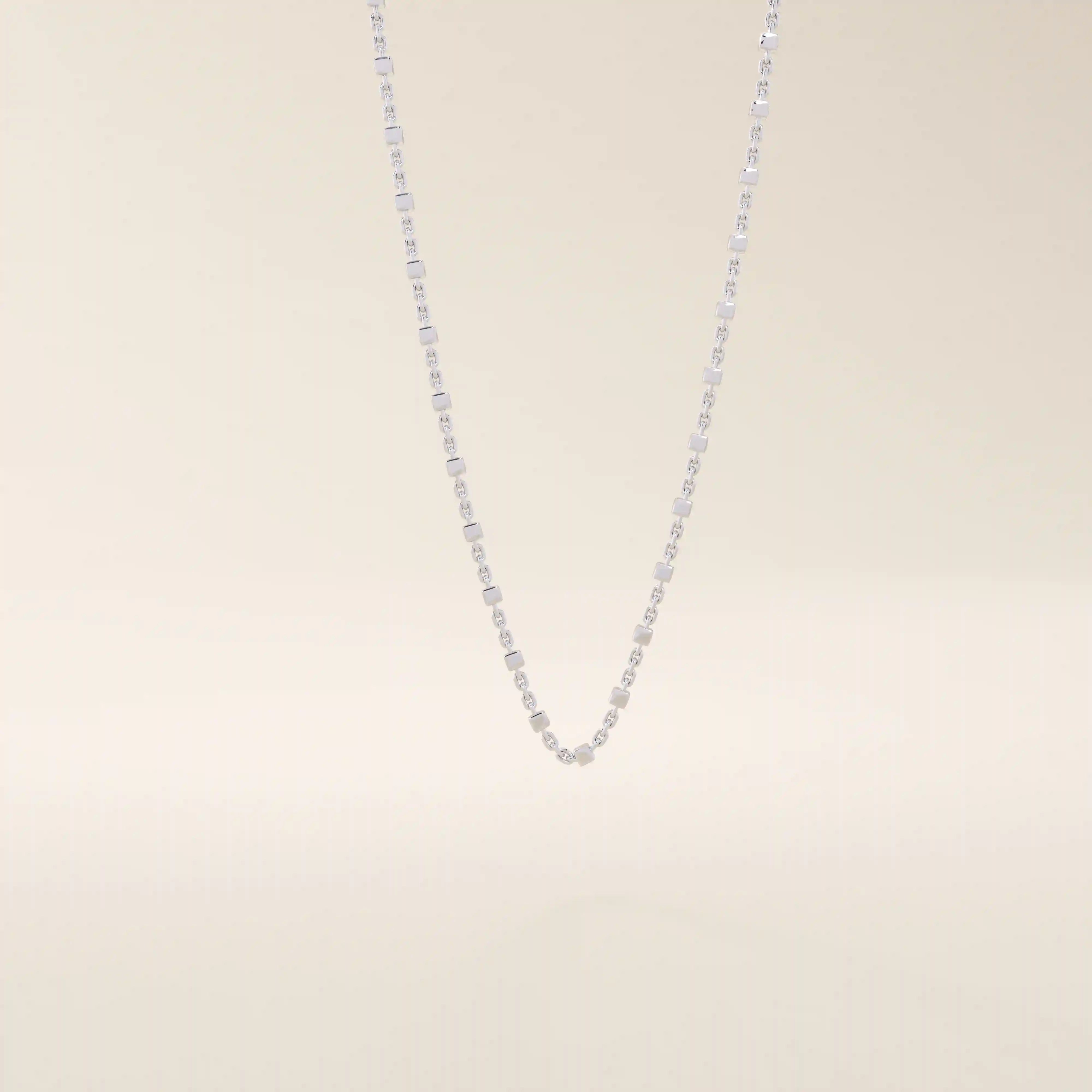 14k solid white gold dot chain necklace with polished flat square stations evenly distributed along the chain, offering a minimalist yet eye-catching design.
