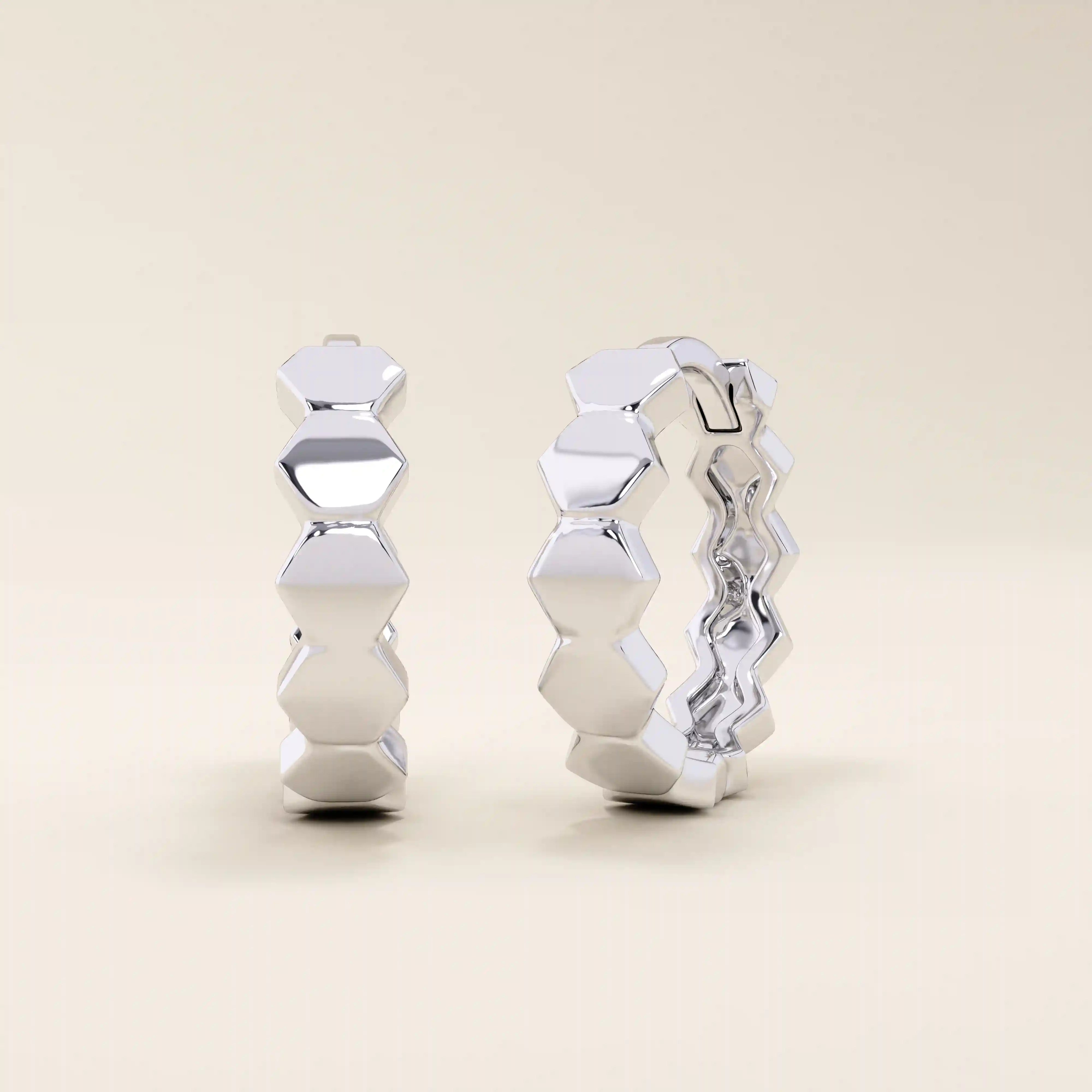 14k solid white gold hoop earrings crafted from a sequence of smooth, interconnected hexagon shapes, giving a modern geometric twist to a classic hoop.