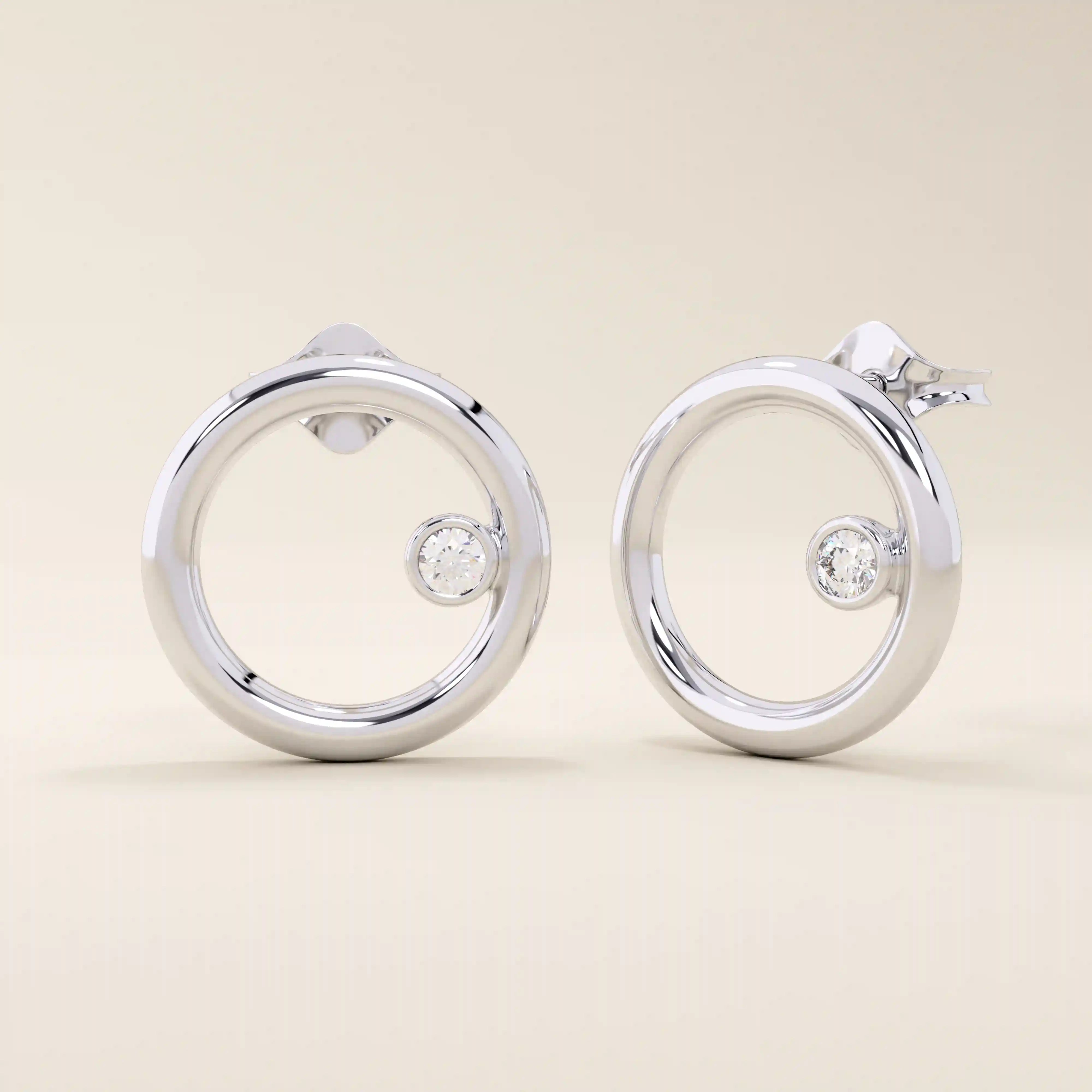 14k solid white gold open circle stud earrings featuring a floating bezel-set round moissanite accent.