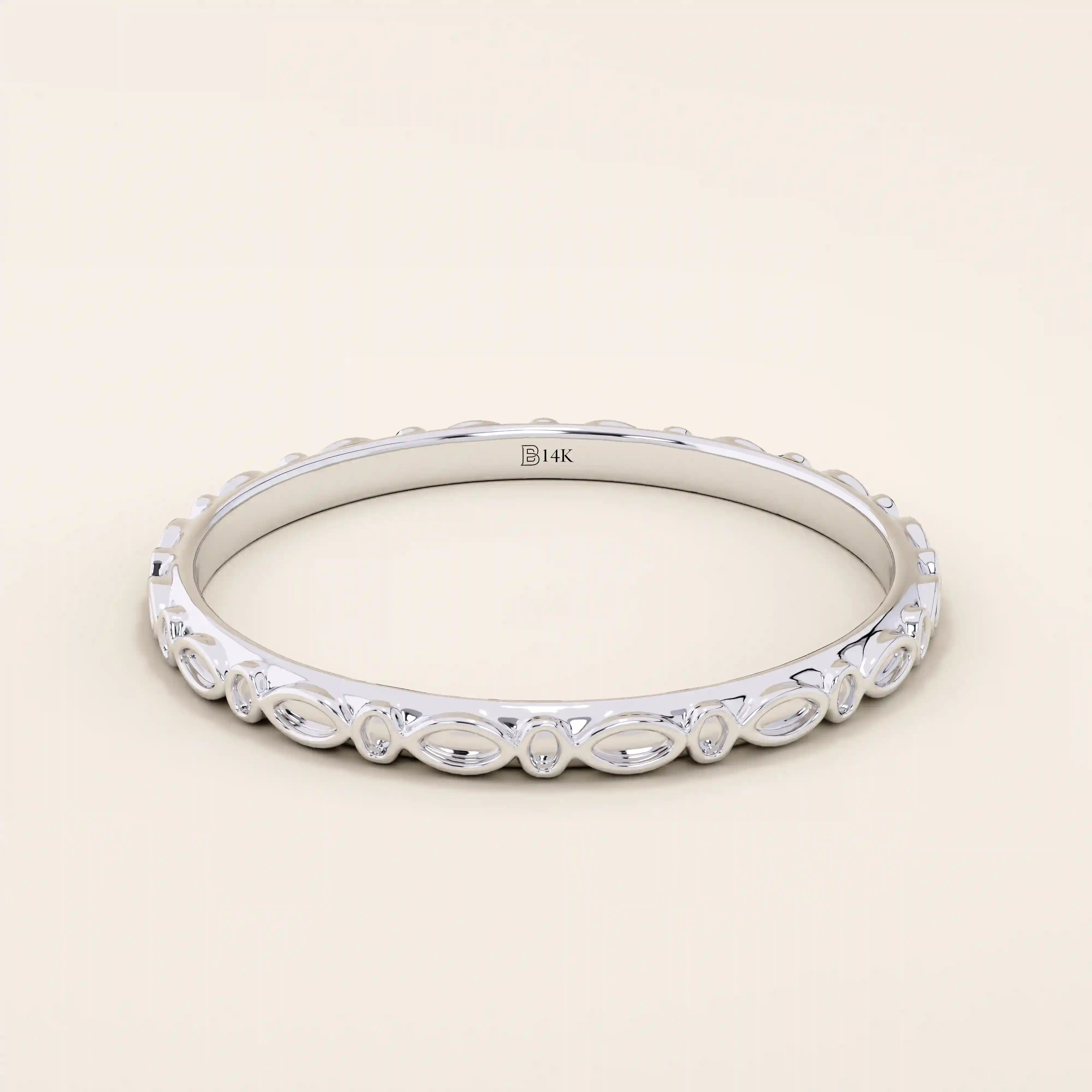 14k solid white gold slim wedding band with an engraved marquise motif encircling the ring.