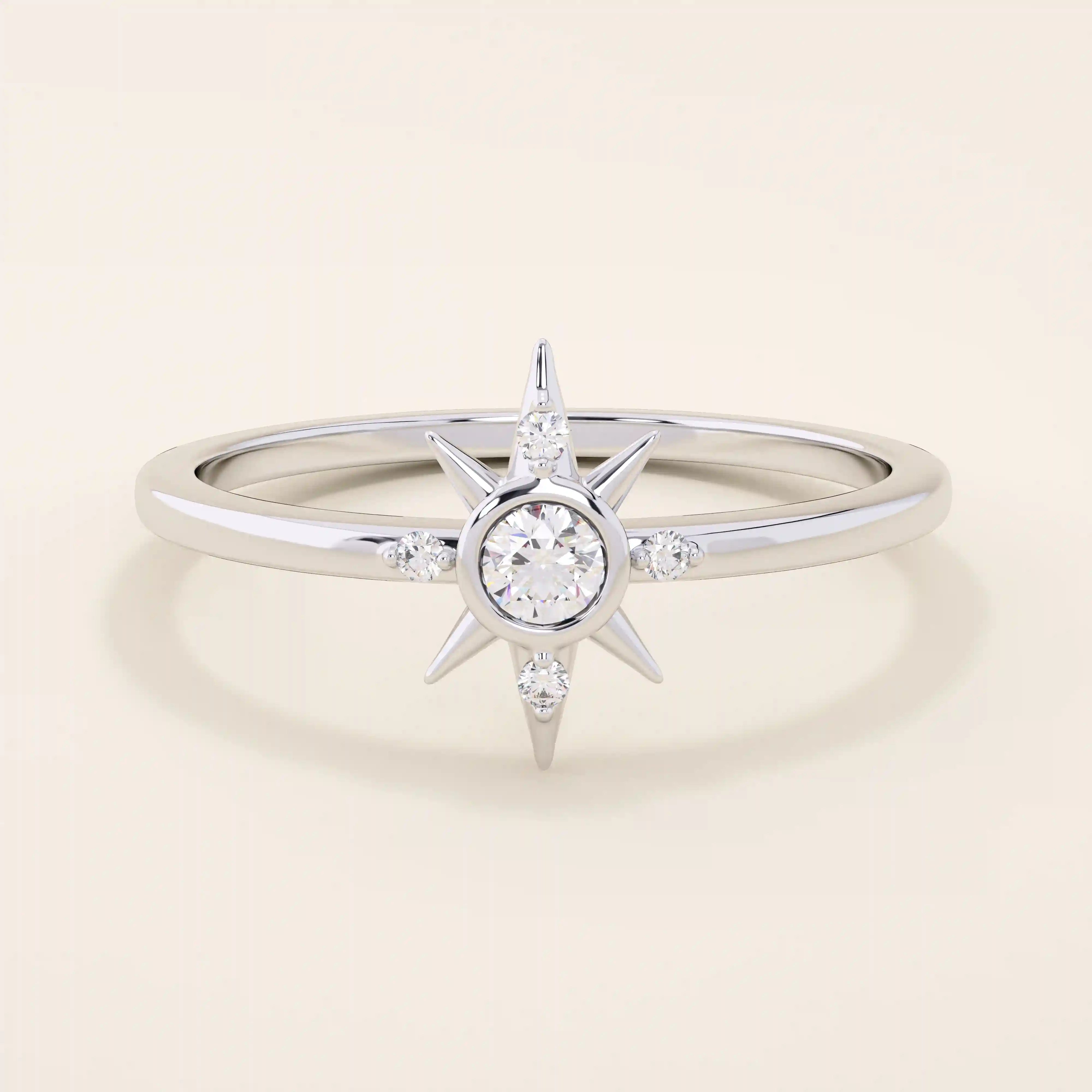 14k solid white gold starburst ring with a central round moissanite and smaller accent stones radiating along the points.