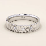 14k solid white gold wide wedding band with a wood grain texture and three bezel set round brilliant cut moissanite stones, distinctive and modern statement ring