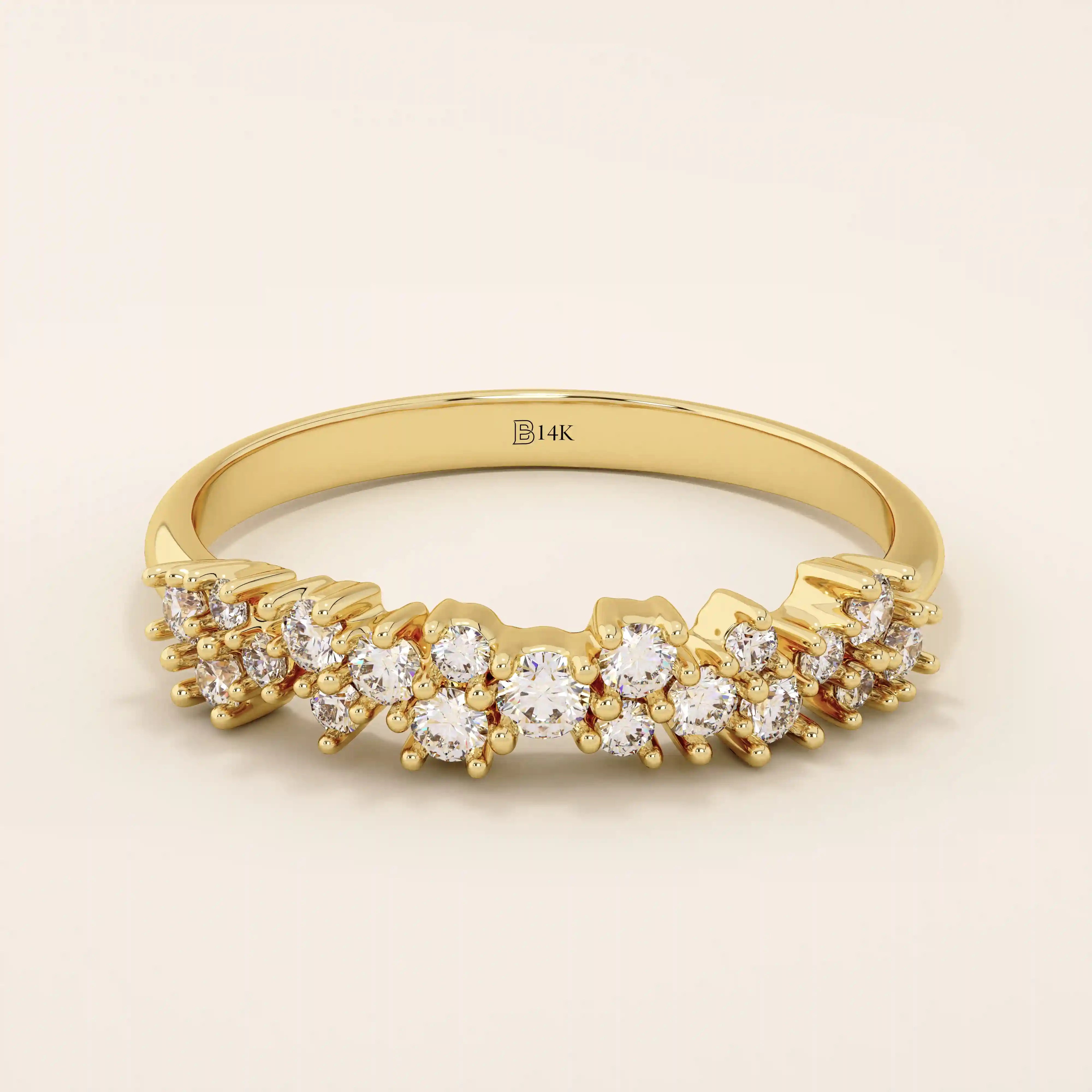 14k solid yellow gold band featuring clusters of round brilliant cut moissanite stones in prong settings, creating a textured and sparkling fine jewelry design for weddings or special occasions