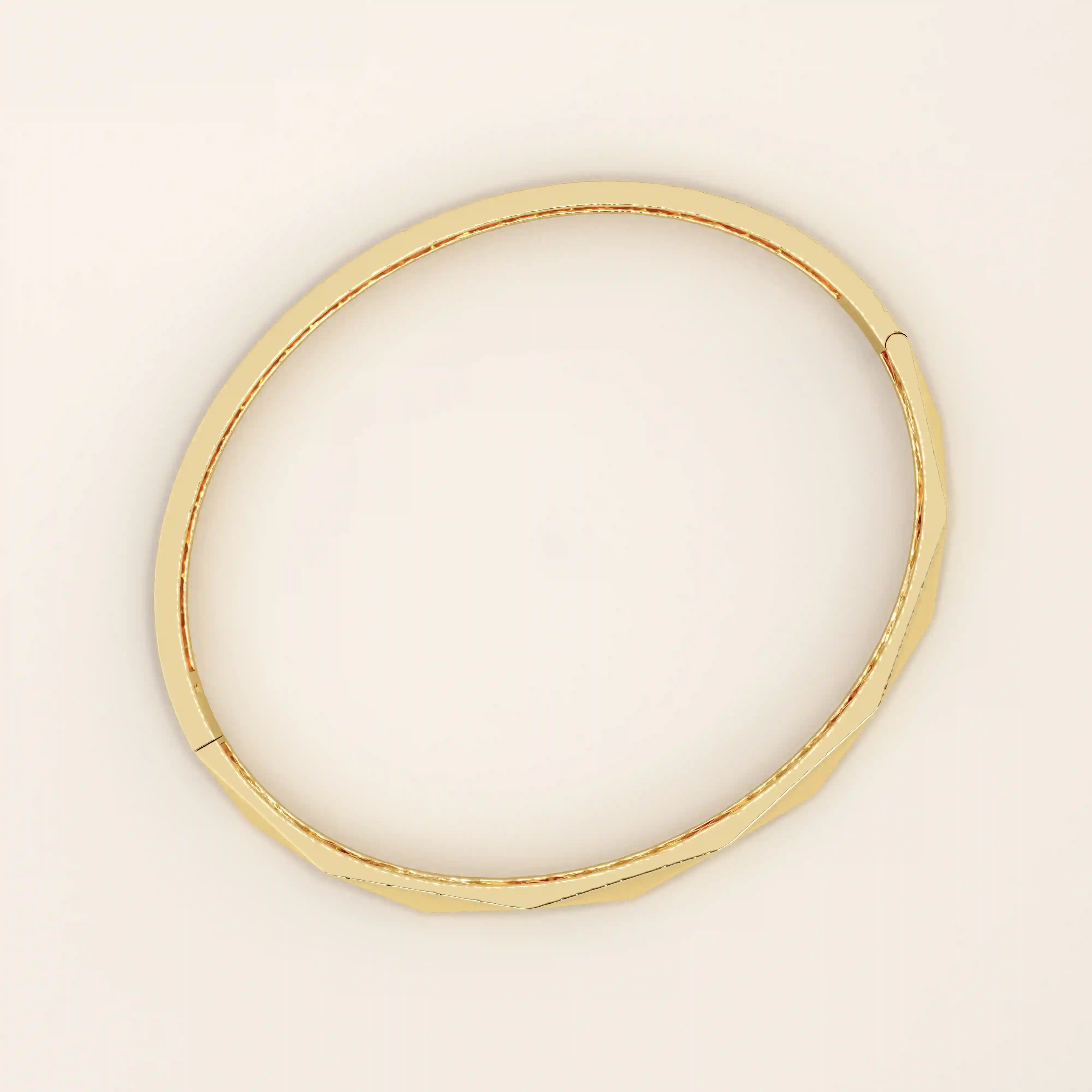 14k solid yellow gold bangle bracelet with a sleek faceted design, featuring geometric angled cuts that reflect light beautifully for a modern, sophisticated look.