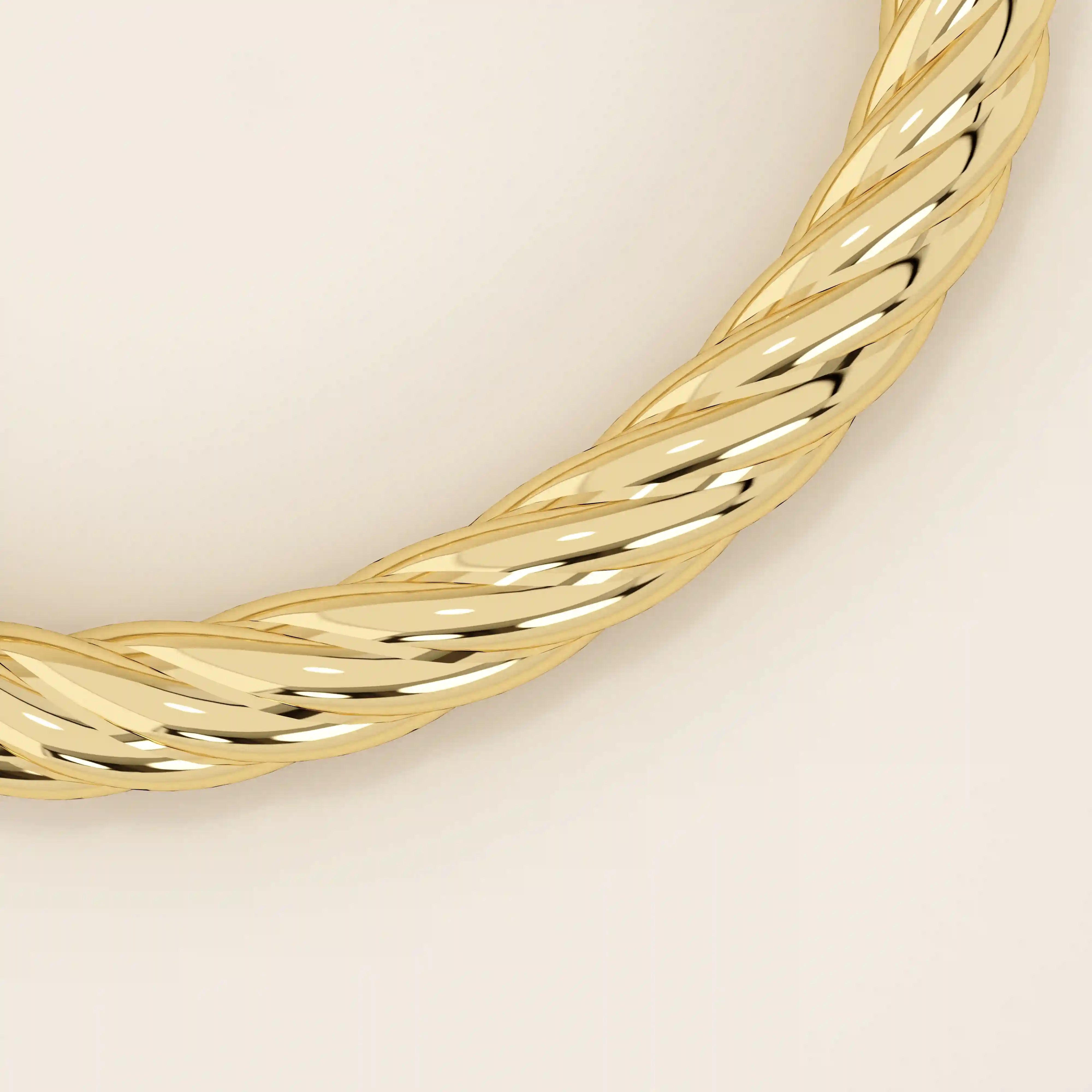 14k solid yellow gold bangle with a bold twisted rope design, featuring a high-polish finish and secure clasp closure for a luxurious, statement-making look.