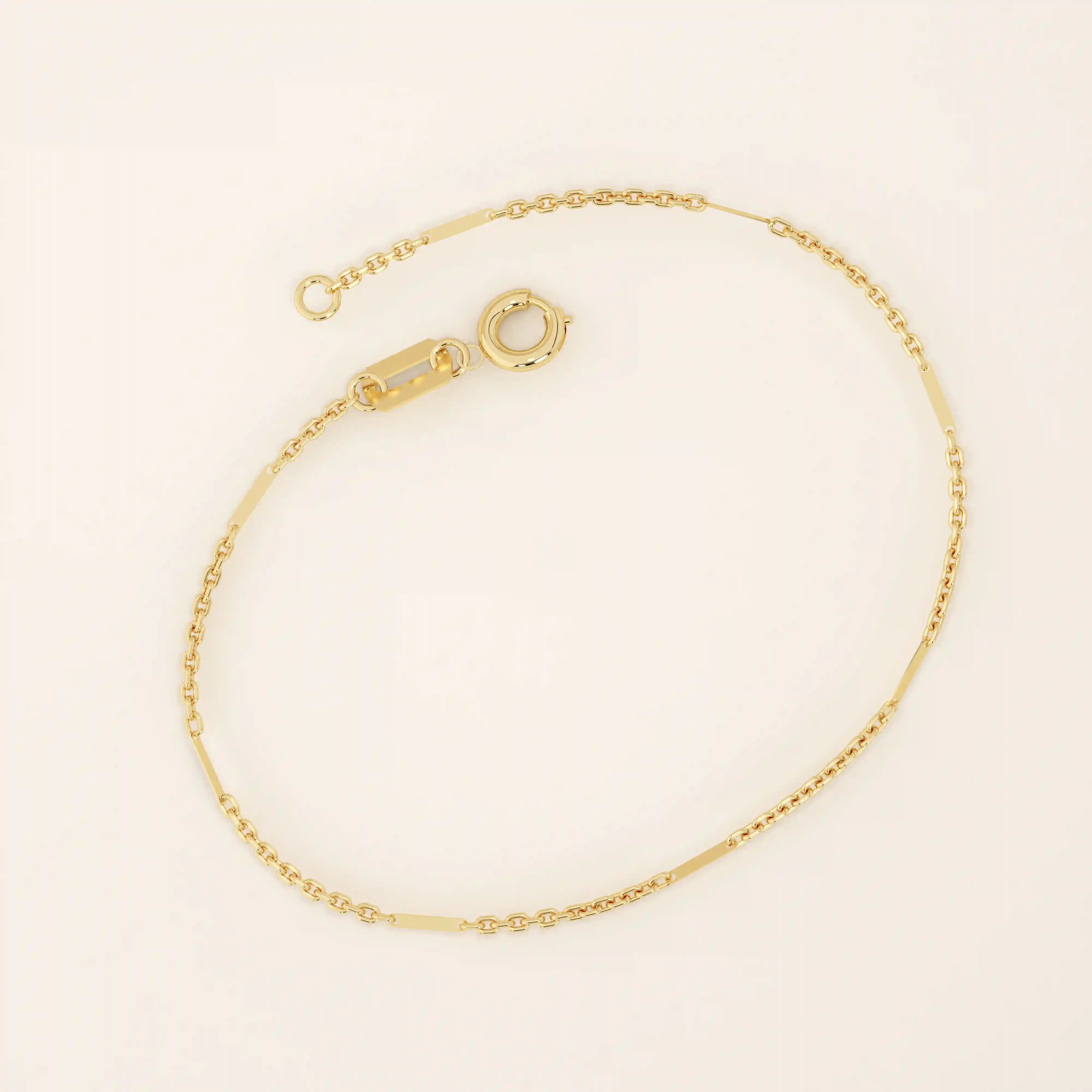 14k solid yellow gold flat bar chain bracelet featuring sleek rectangular links spaced along a delicate gold chain, offering a minimalist yet sophisticated style.