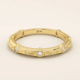 14k solid yellow gold wedding band with a bamboo-inspired design, featuring evenly spaced round brilliant-cut moissanites