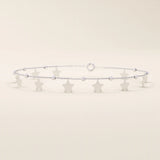 14k white gold bracelet featuring dangling star-shaped charms and textured bead details on a slim chain.