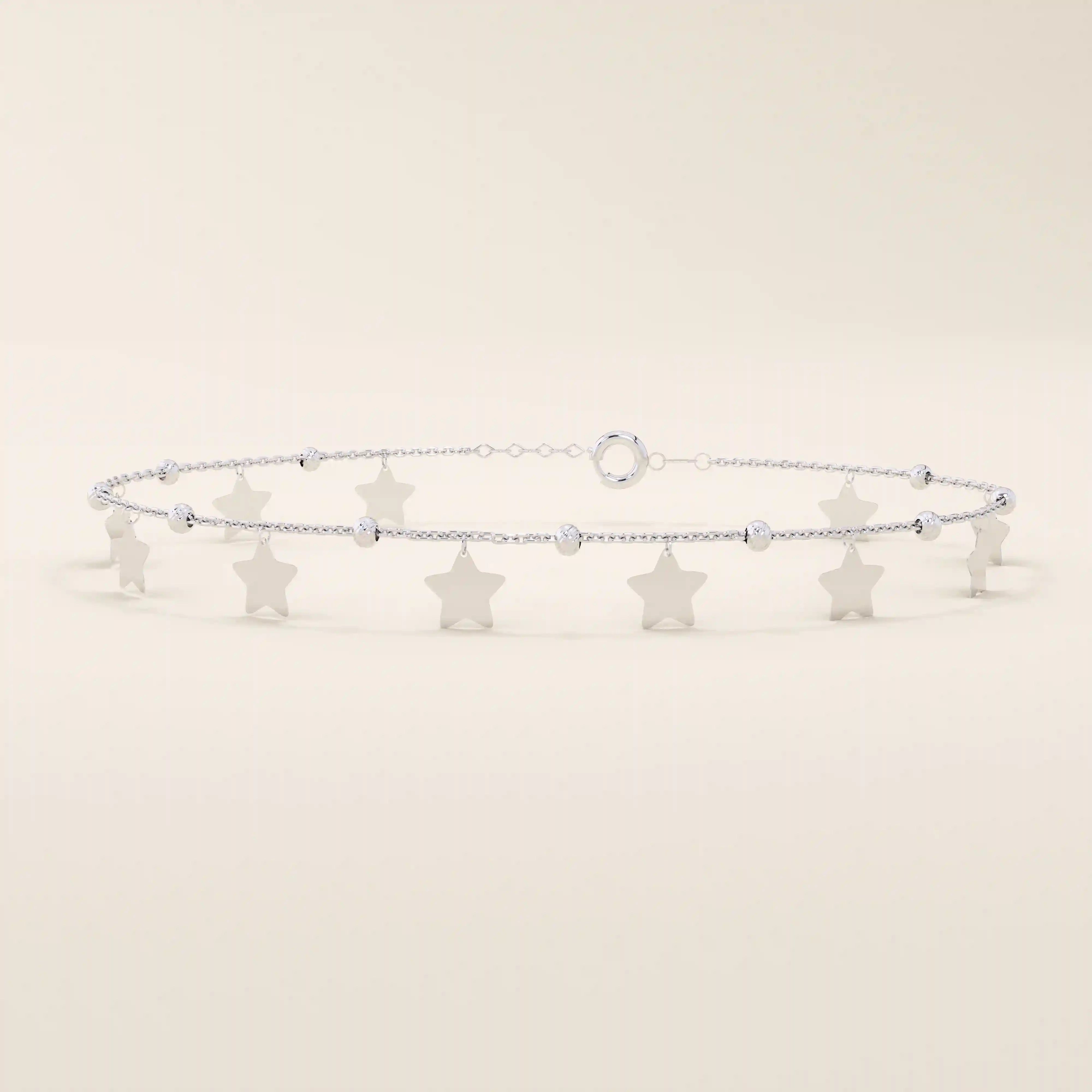 14k white gold bracelet featuring dangling star-shaped charms and textured bead details on a slim chain.