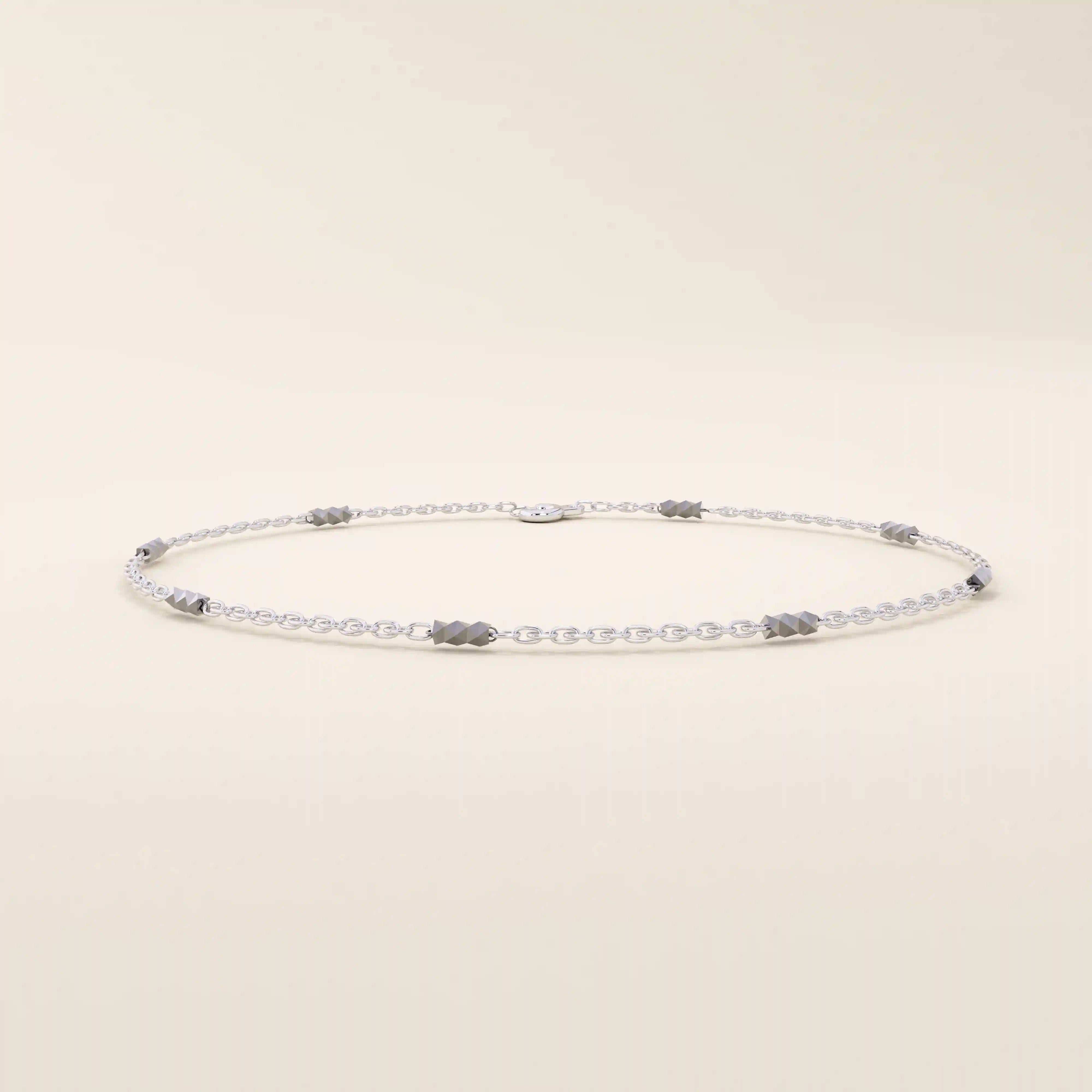 14k white gold bracelet featuring oval chain links with alternating polished yellow gold bar accents.