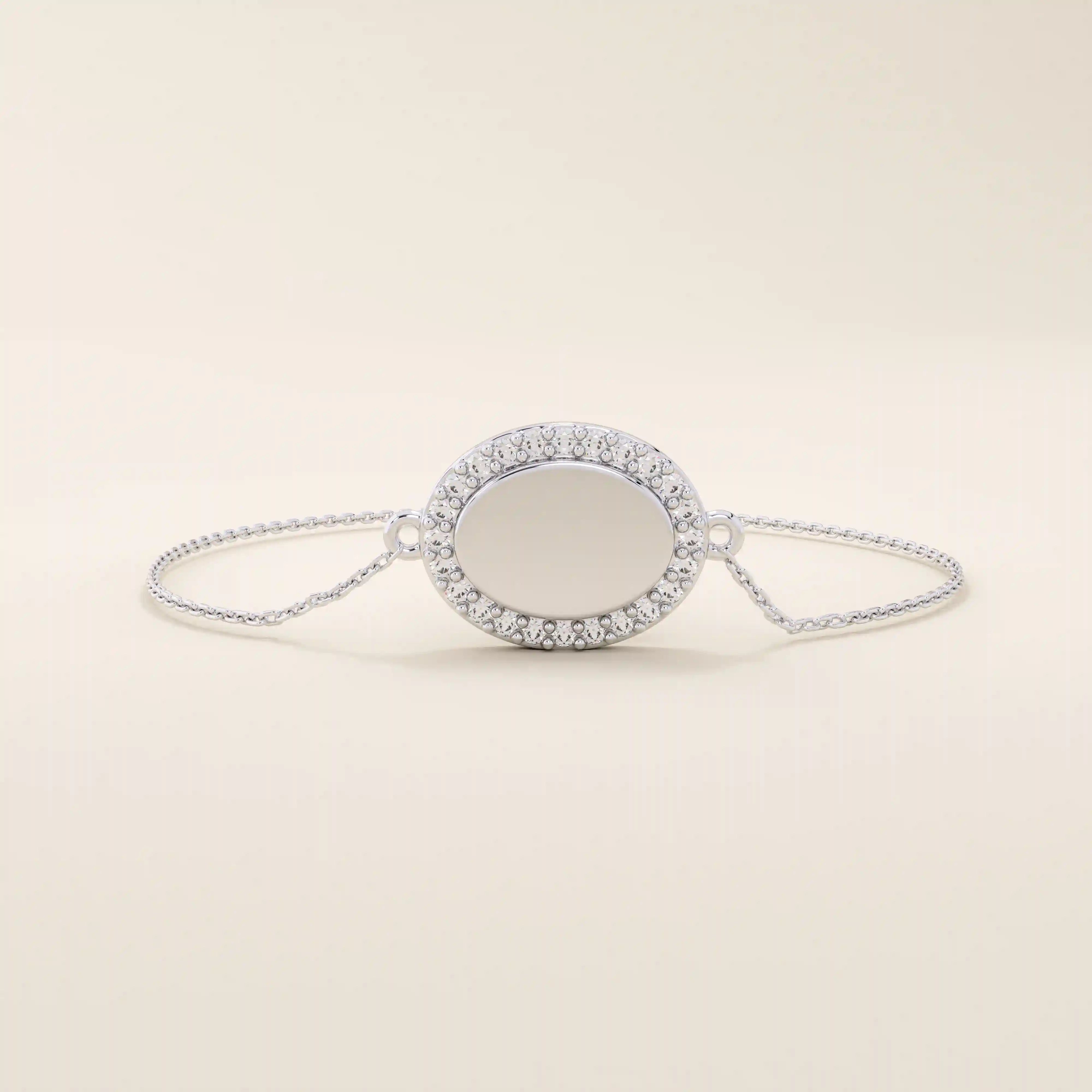 14k white gold bracelet with an oval centerpiece surrounded by pavé moissanite stones, crafted on a fine chain.