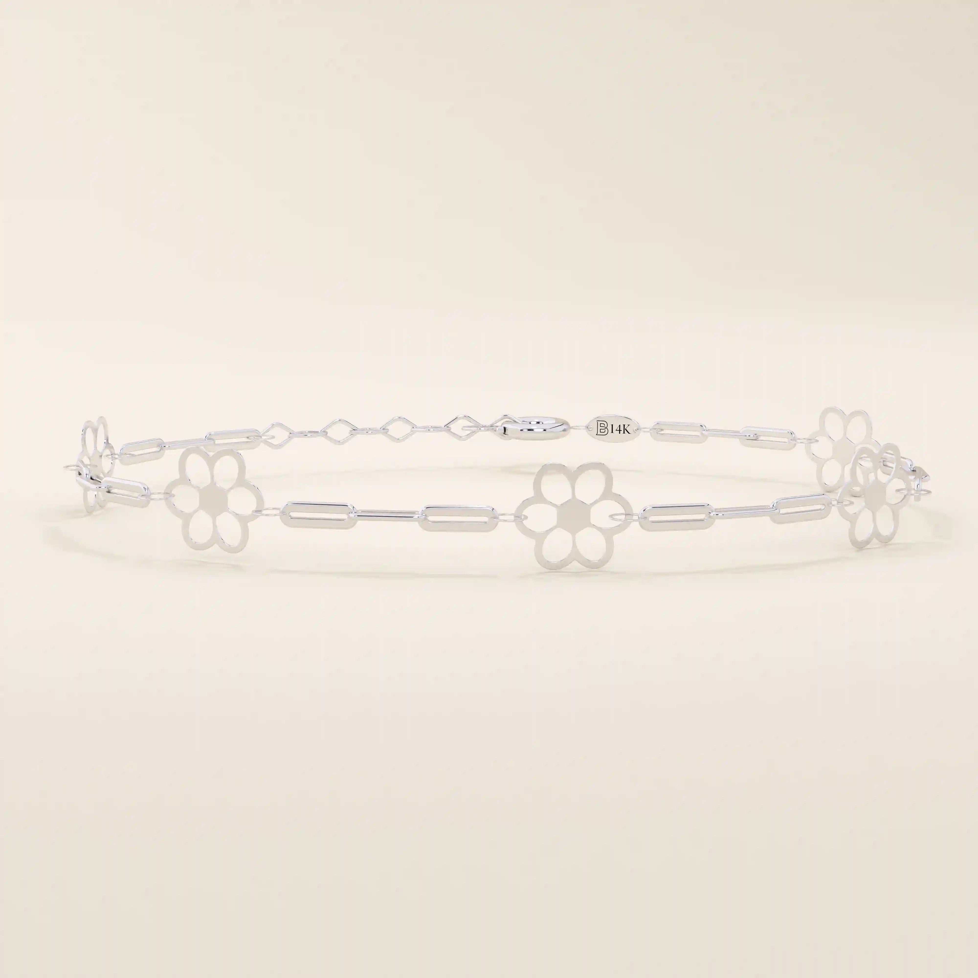 14k white gold bracelet with small flower motifs connected by slim chain links, crafted for a refined look.