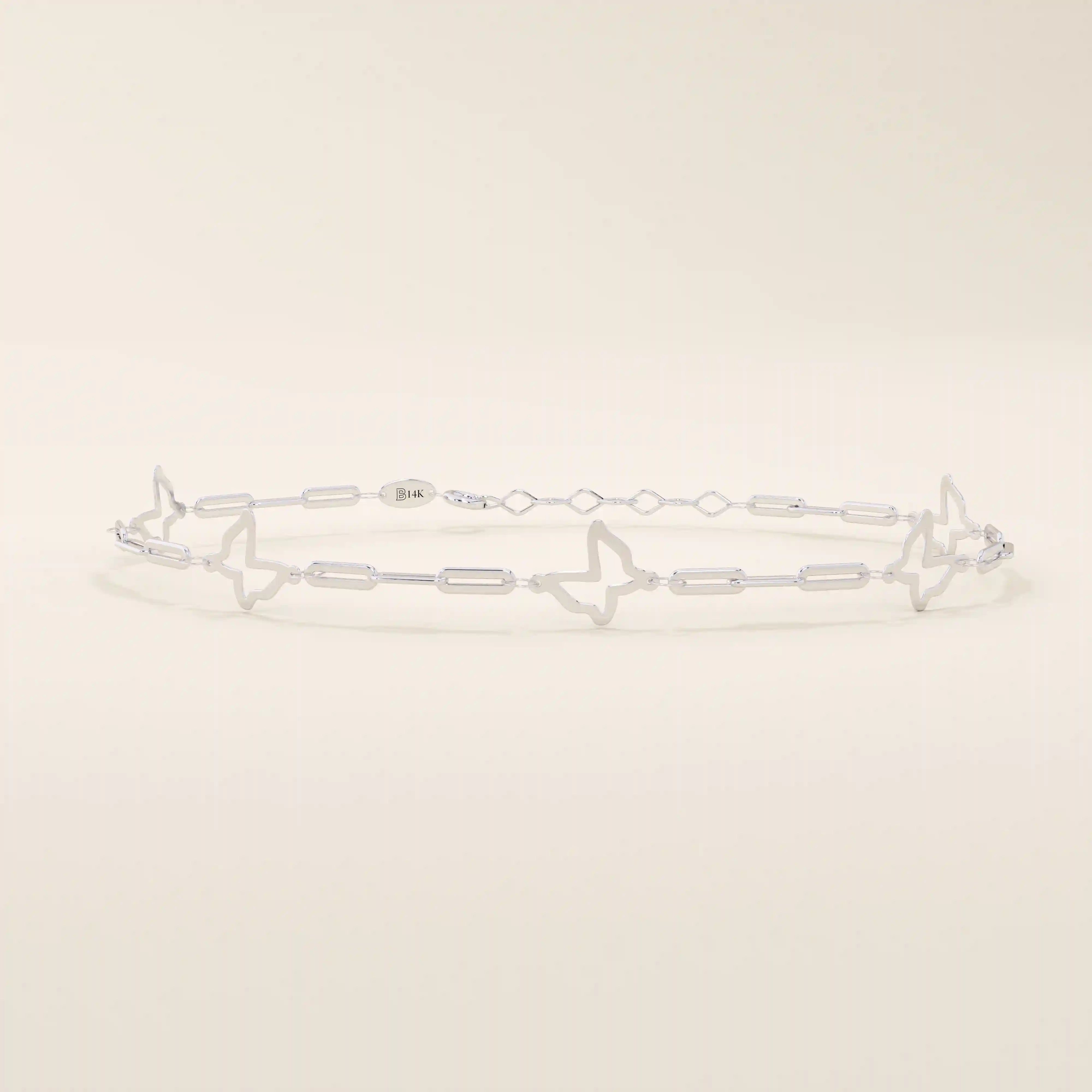 14k white gold butterfly bracelet with open butterfly silhouettes connected by polished chain links.