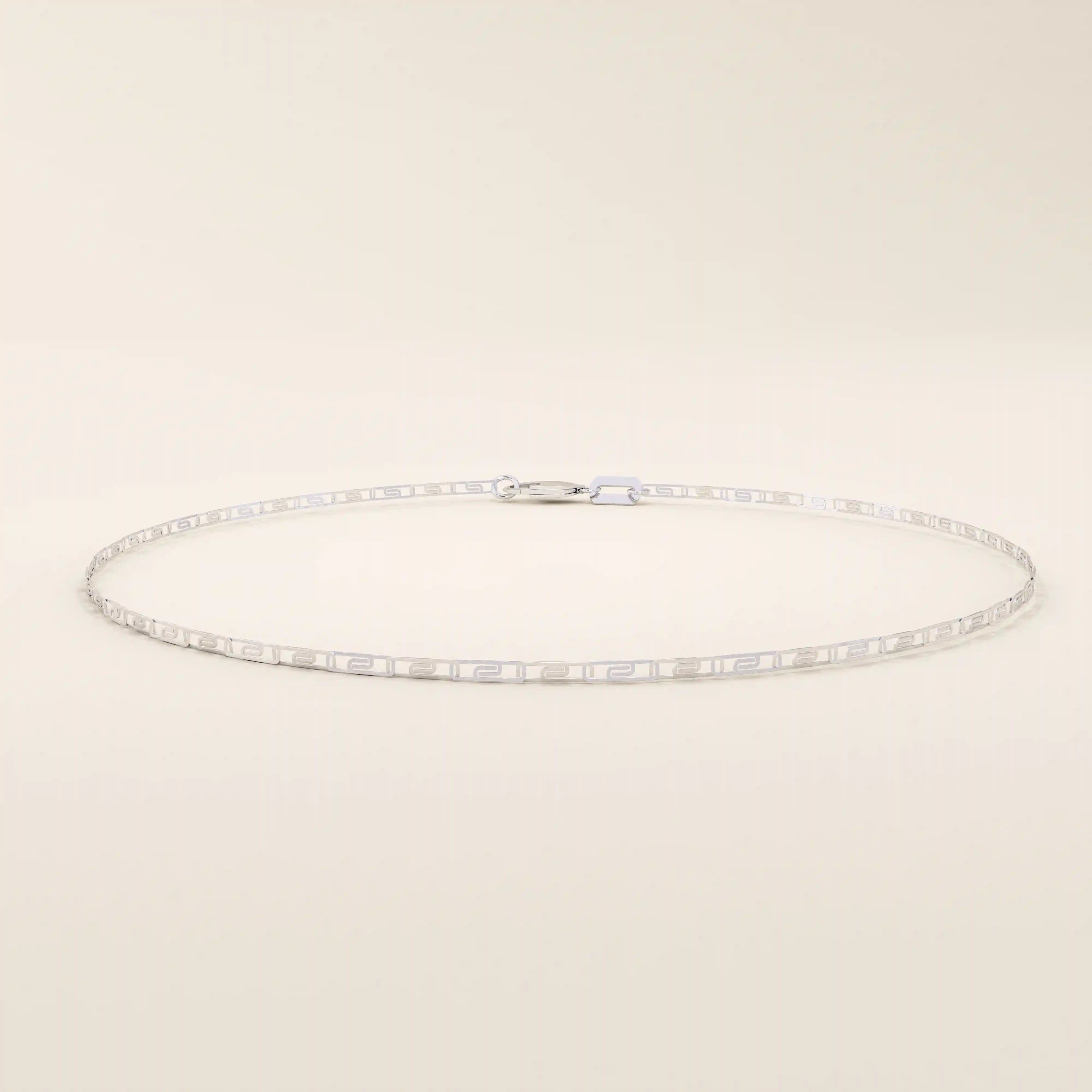 14k white gold scroll chain bracelet with polished rectangular links and delicate scroll cut-out details.