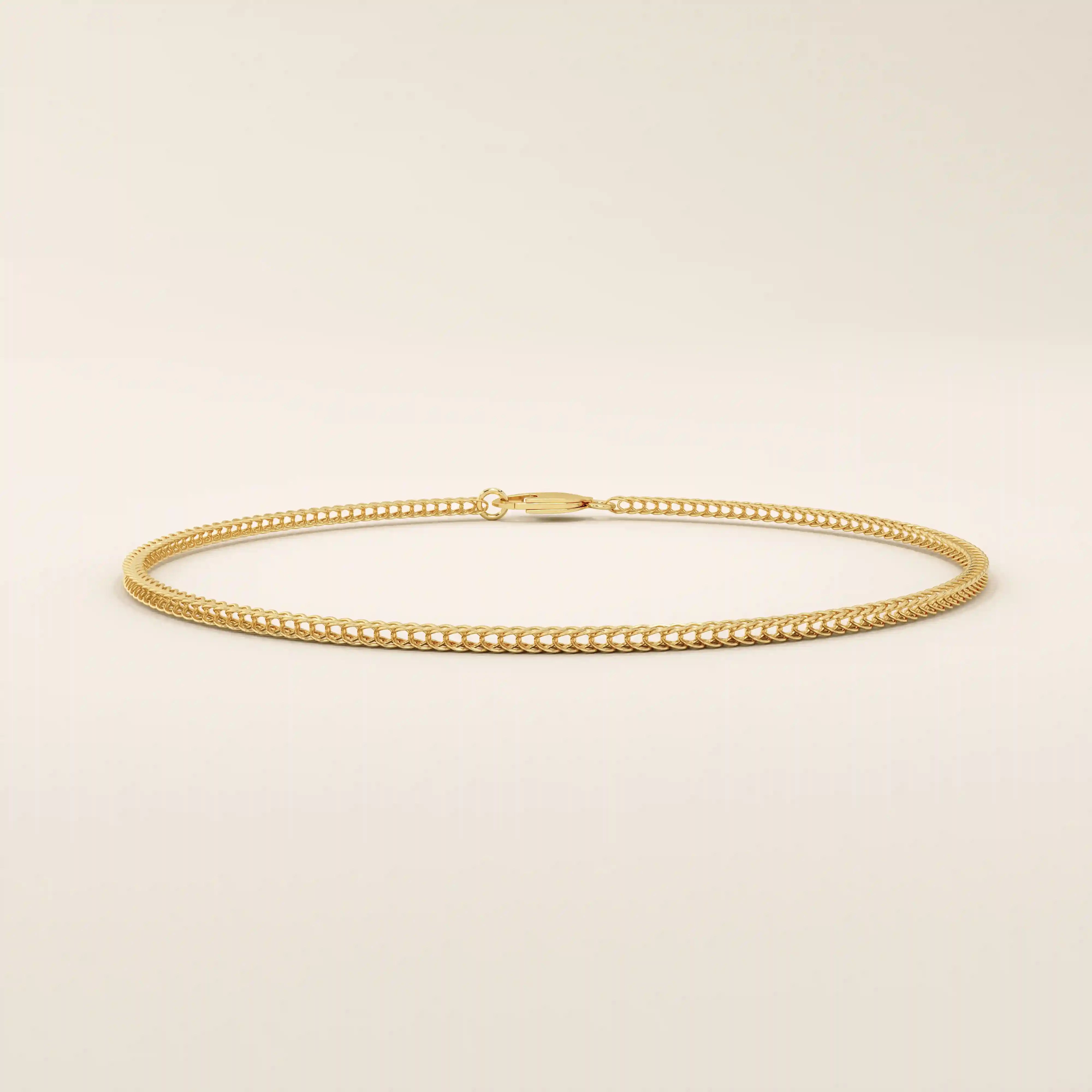 14k yellow gold bracelet with a delicate wheat chain design, polished and elegant.