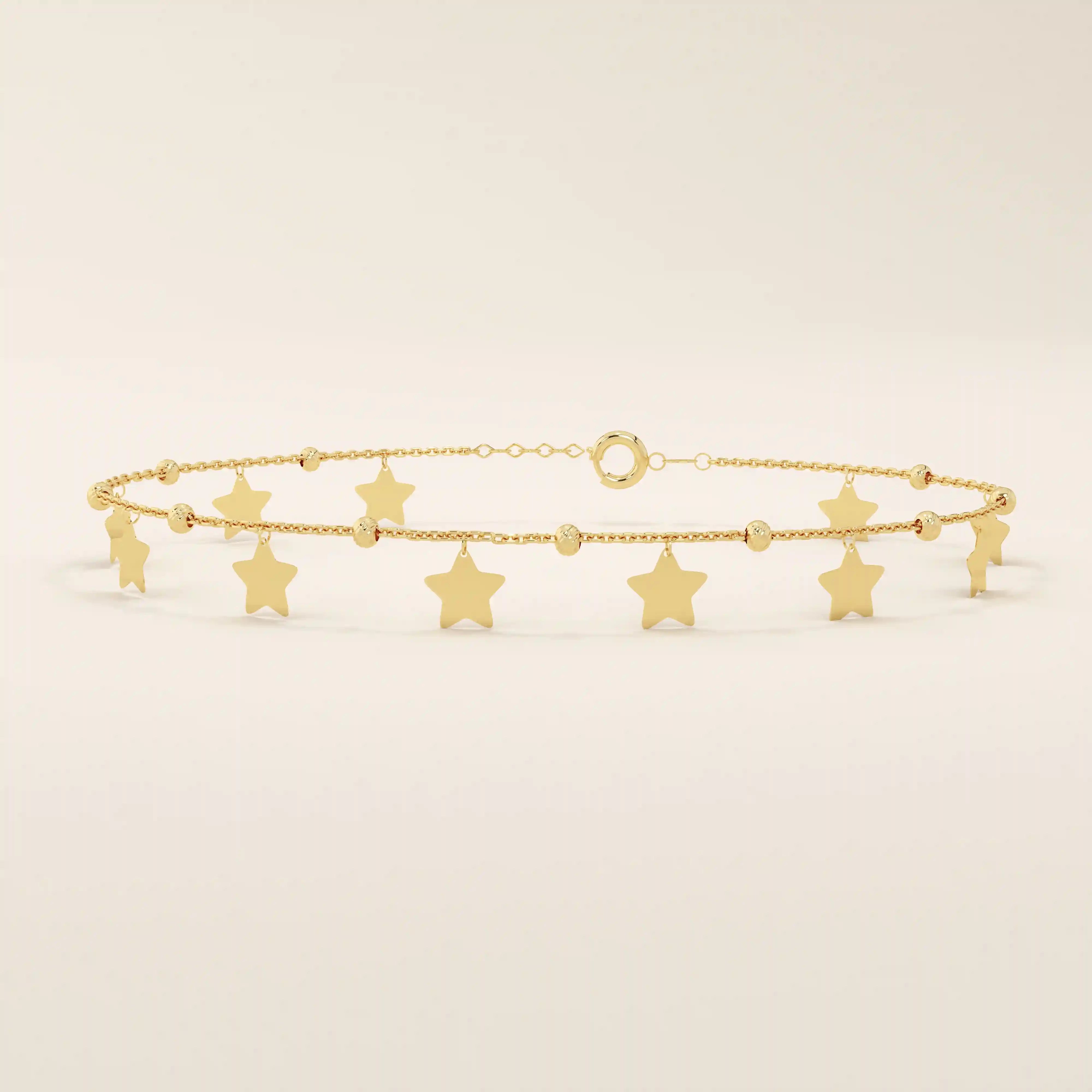 14k yellow gold bracelet with dangling star charms and delicate twisted bead accents along a fine chain.