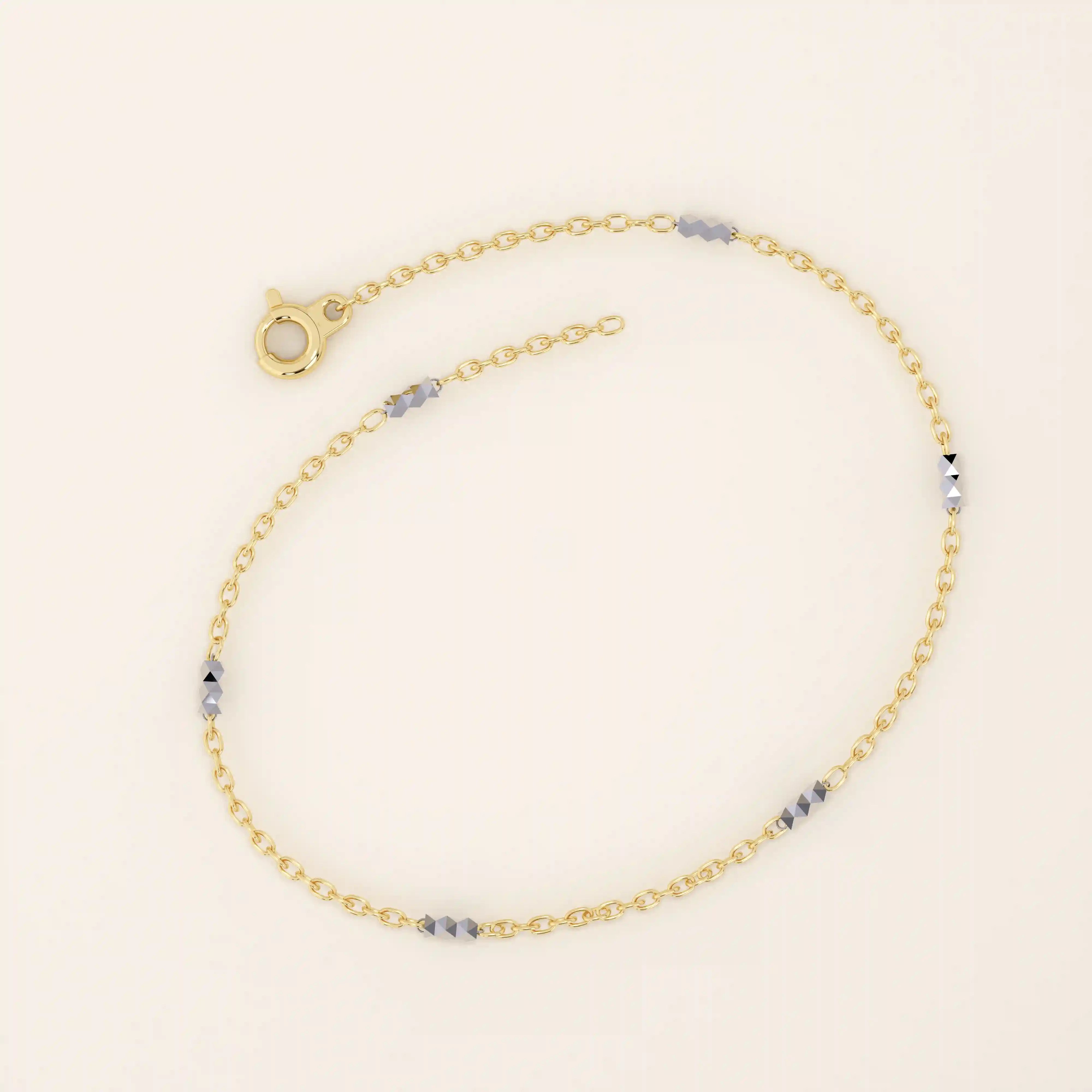 14k yellow gold bracelet with polished oval links and faceted white gold bar accents for a modern contrast.
