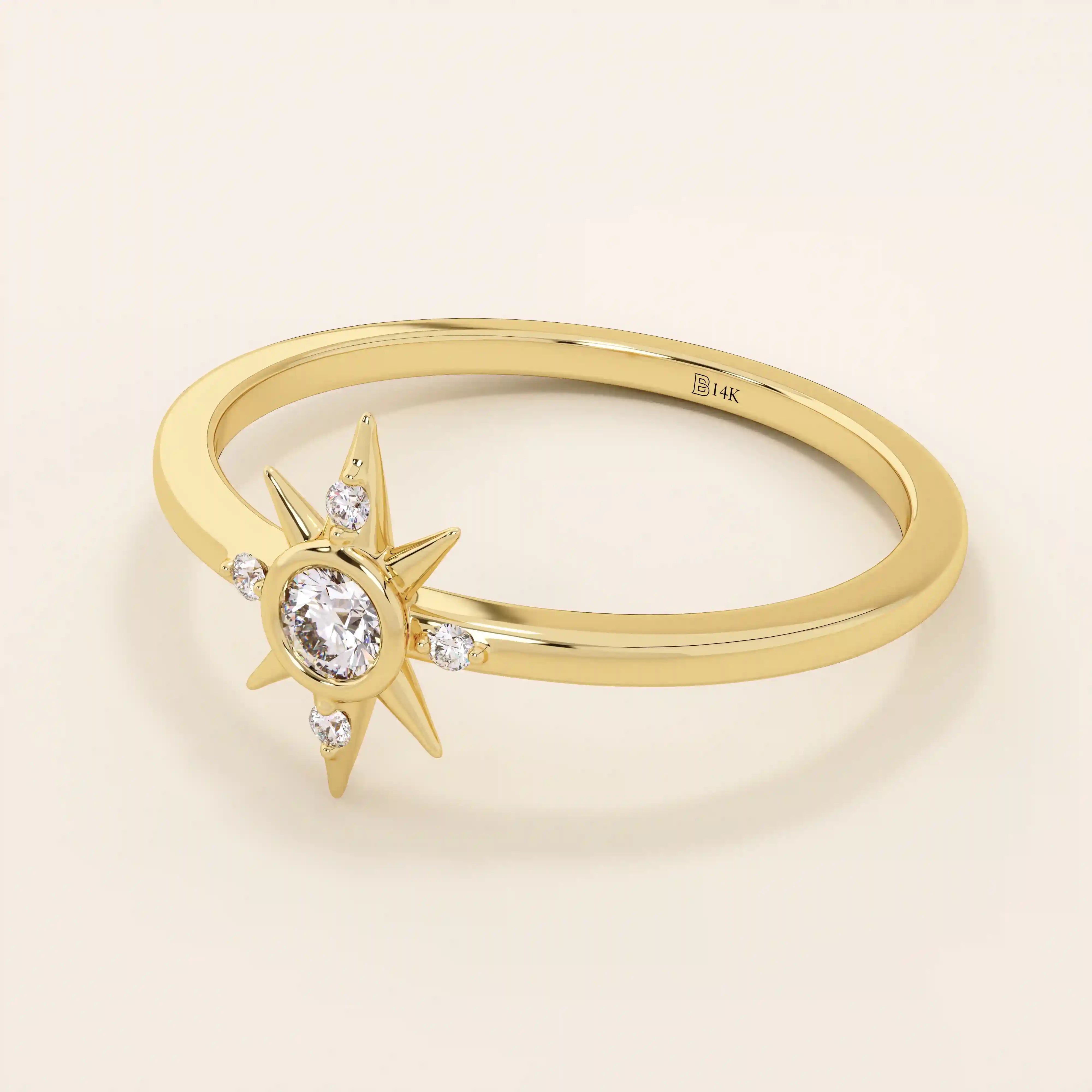 Angled view of a 14k yellow gold starburst ring, highlighting its radiant moissanite center and delicate side stones.