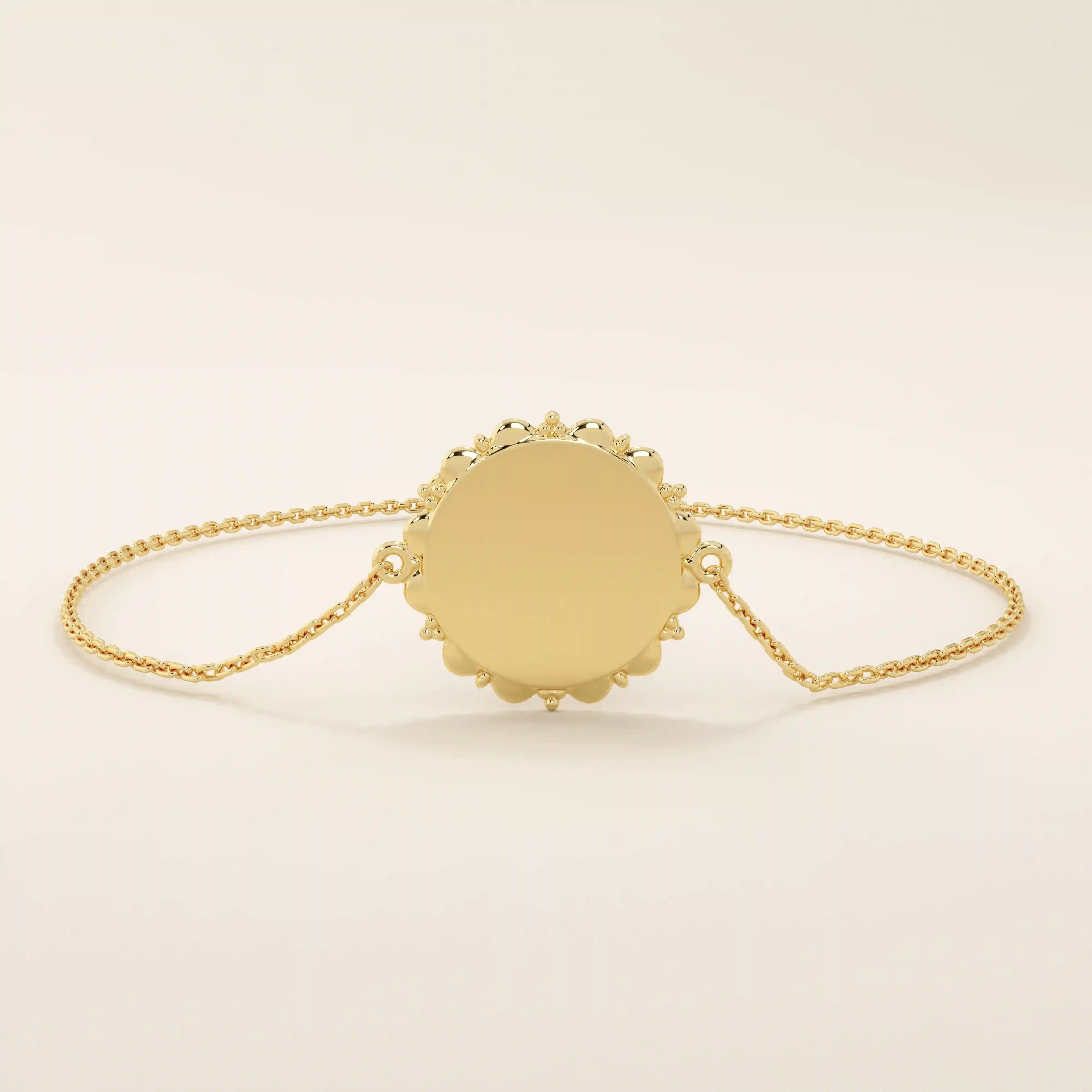 Angled view of a 14k yellow gold sun bracelet highlighting the detailed circular medallion with radiant edges on a dainty chain.