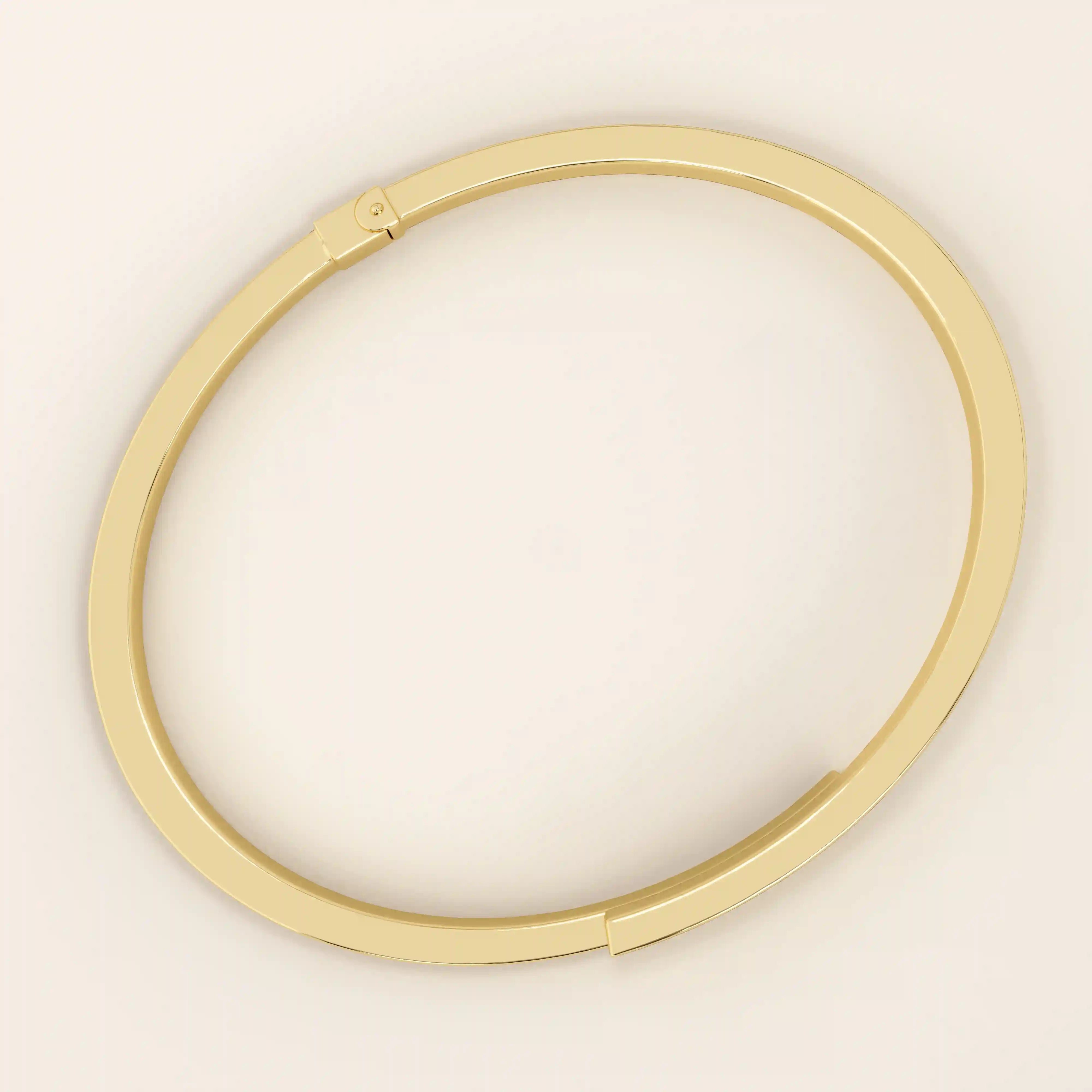 Angled view of a 14k yellow gold wrap-around bracelet highlighting its overlapping band design and smooth curvature.