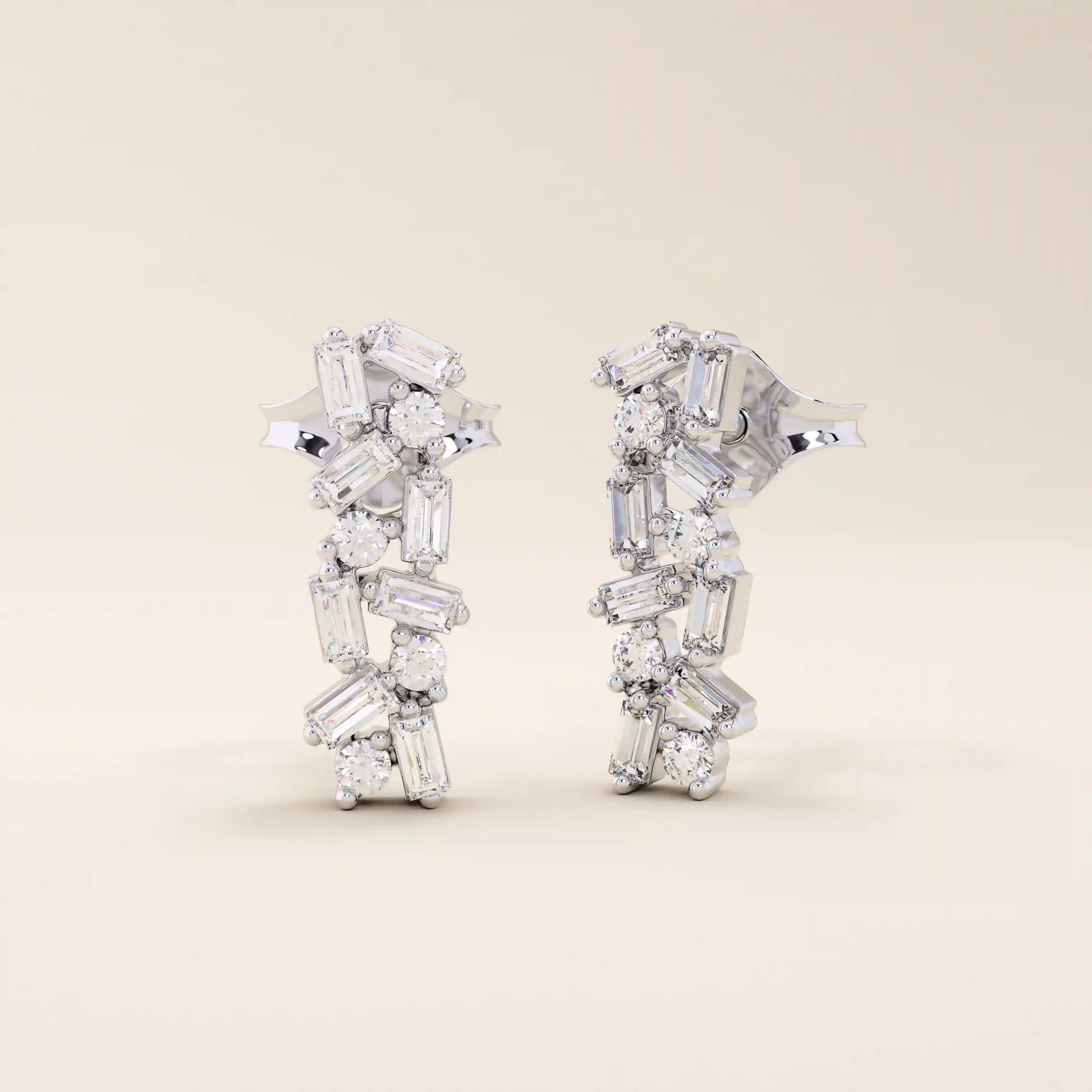 Baguette cluster stud earrings in 14k white gold with alternating baguette and round stones in a modern clustered pattern.