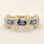 Bold gold ring with five bezel set oval sapphire gemstones. A striking statement ring with a unique symmetrical design.