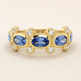 Bold gold ring with five bezel set oval sapphire gemstones. A striking statement ring with a unique symmetrical design.