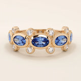 Bold gold ring with five bezel set oval sapphire gemstones. A striking statement ring with a unique symmetrical design.