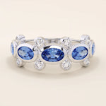 Bold gold ring with five bezel set oval sapphire gemstones. A striking statement ring with a unique symmetrical design.