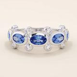 Bold gold ring with five bezel set oval sapphire gemstones. A striking statement ring with a unique symmetrical design.