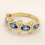 Bold gold ring with five bezel set oval sapphire gemstones. A striking statement ring with a unique symmetrical design.